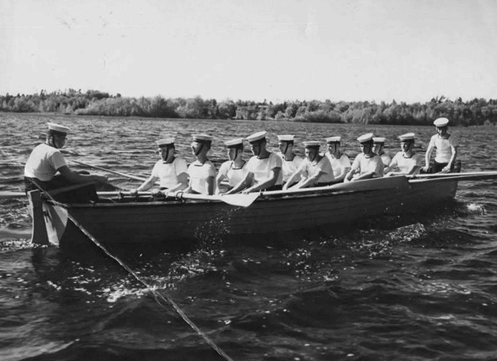 Archival photograph of students sailing on lake