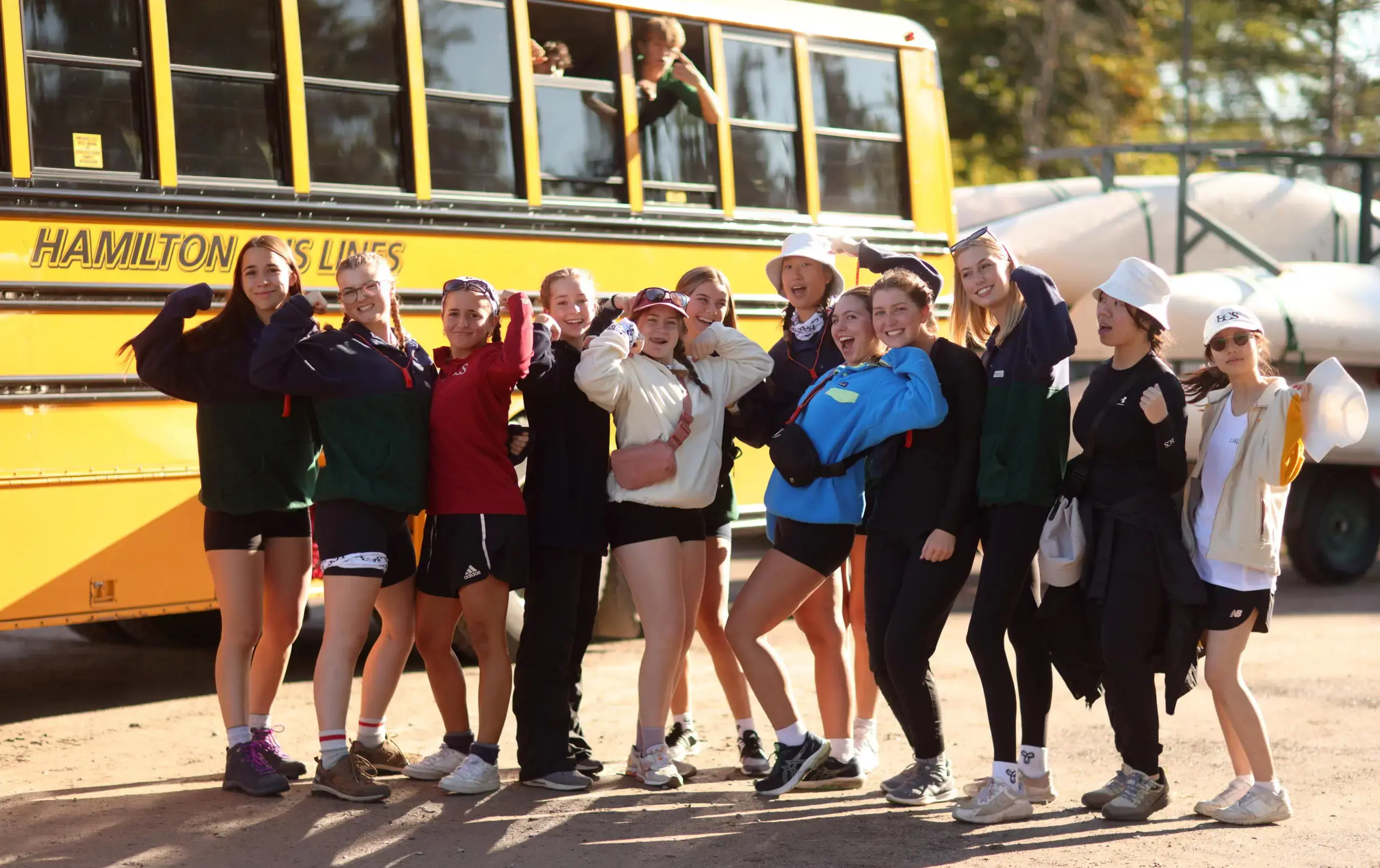 Students standing in front of school bus