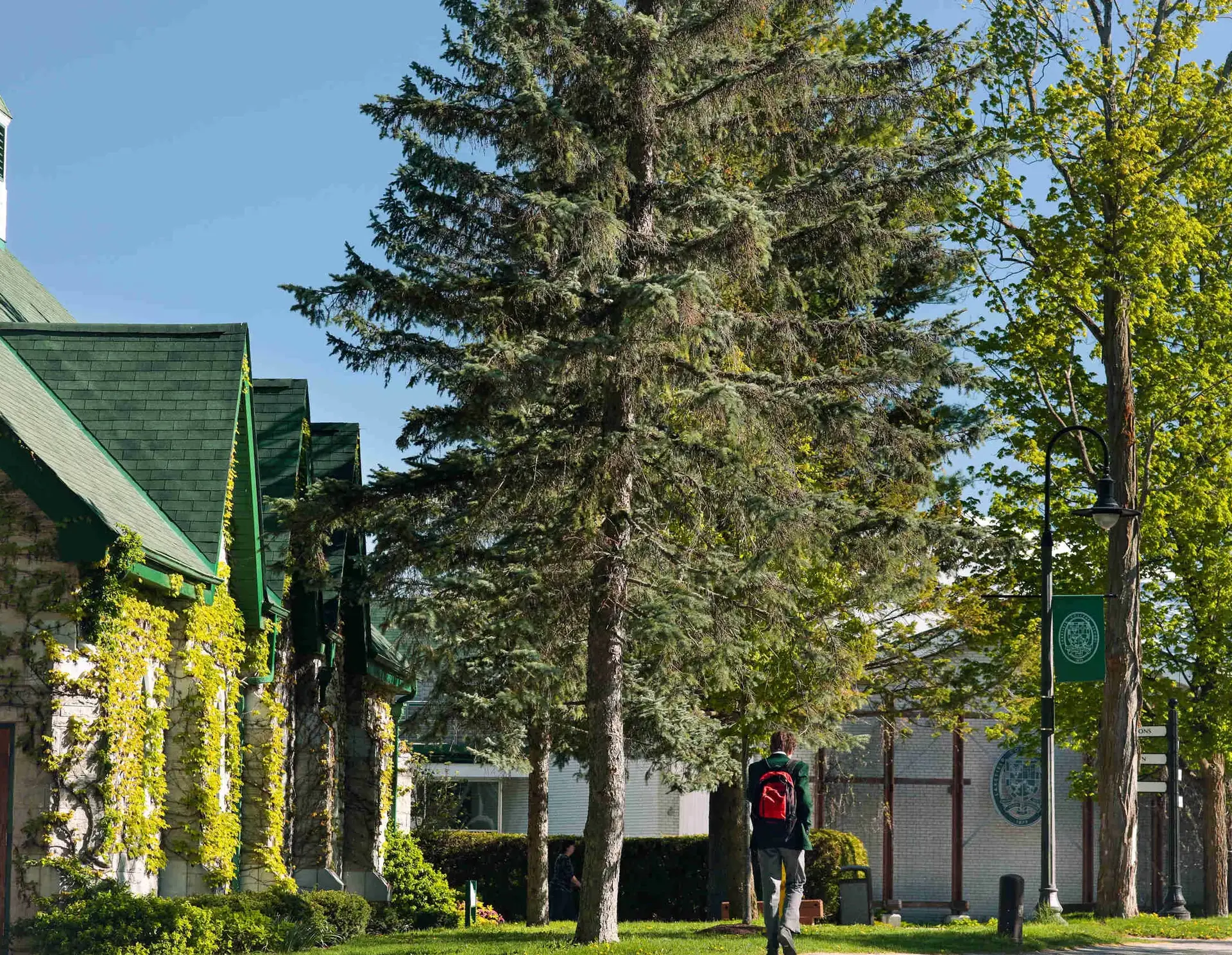 Student walking along path outside Lakefield College School
