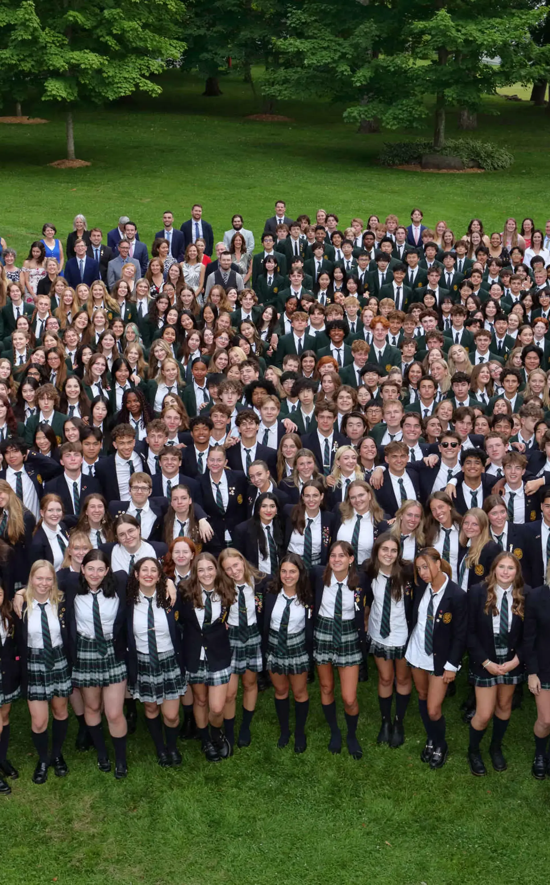Whole-school photo of Lakefield students on grass