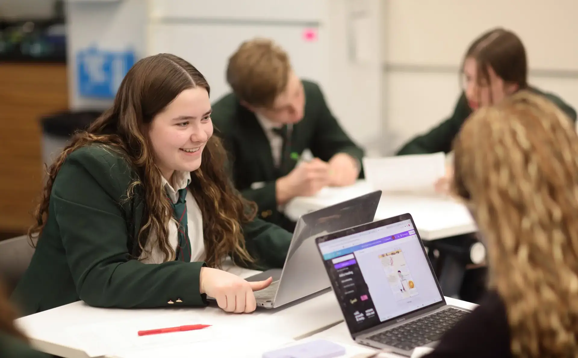 Students working with laptops