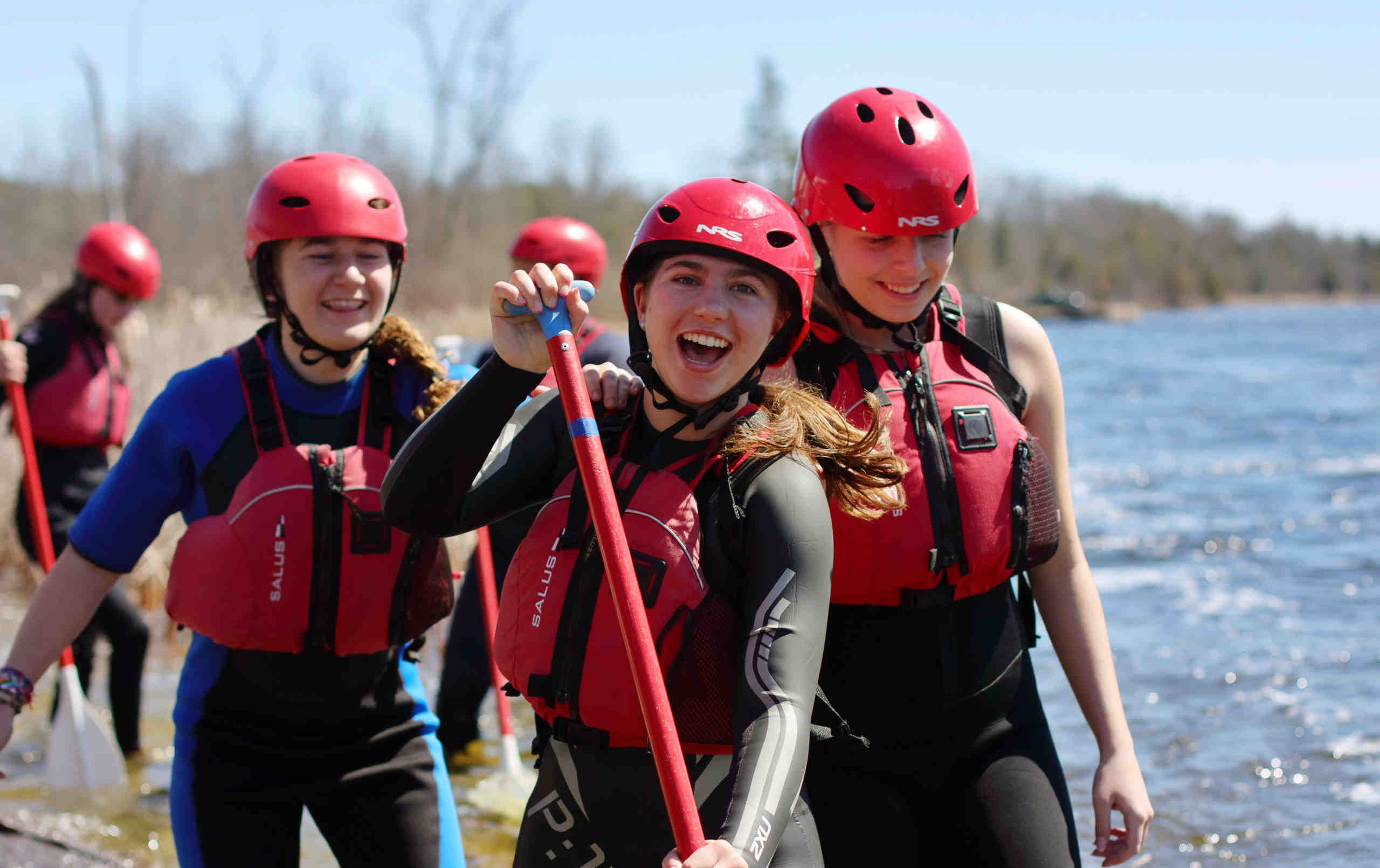 Students holding oars