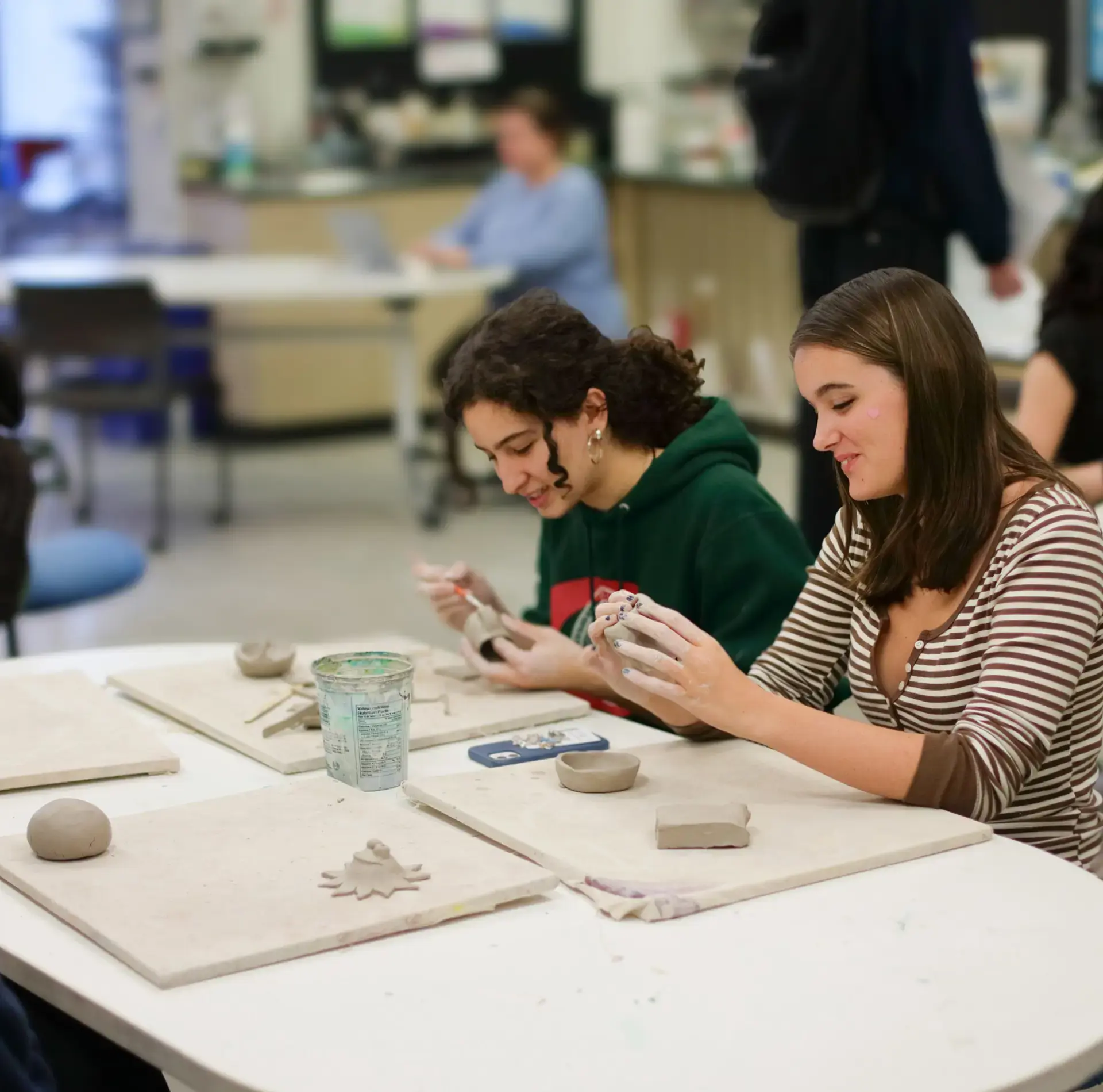 Students working with clay