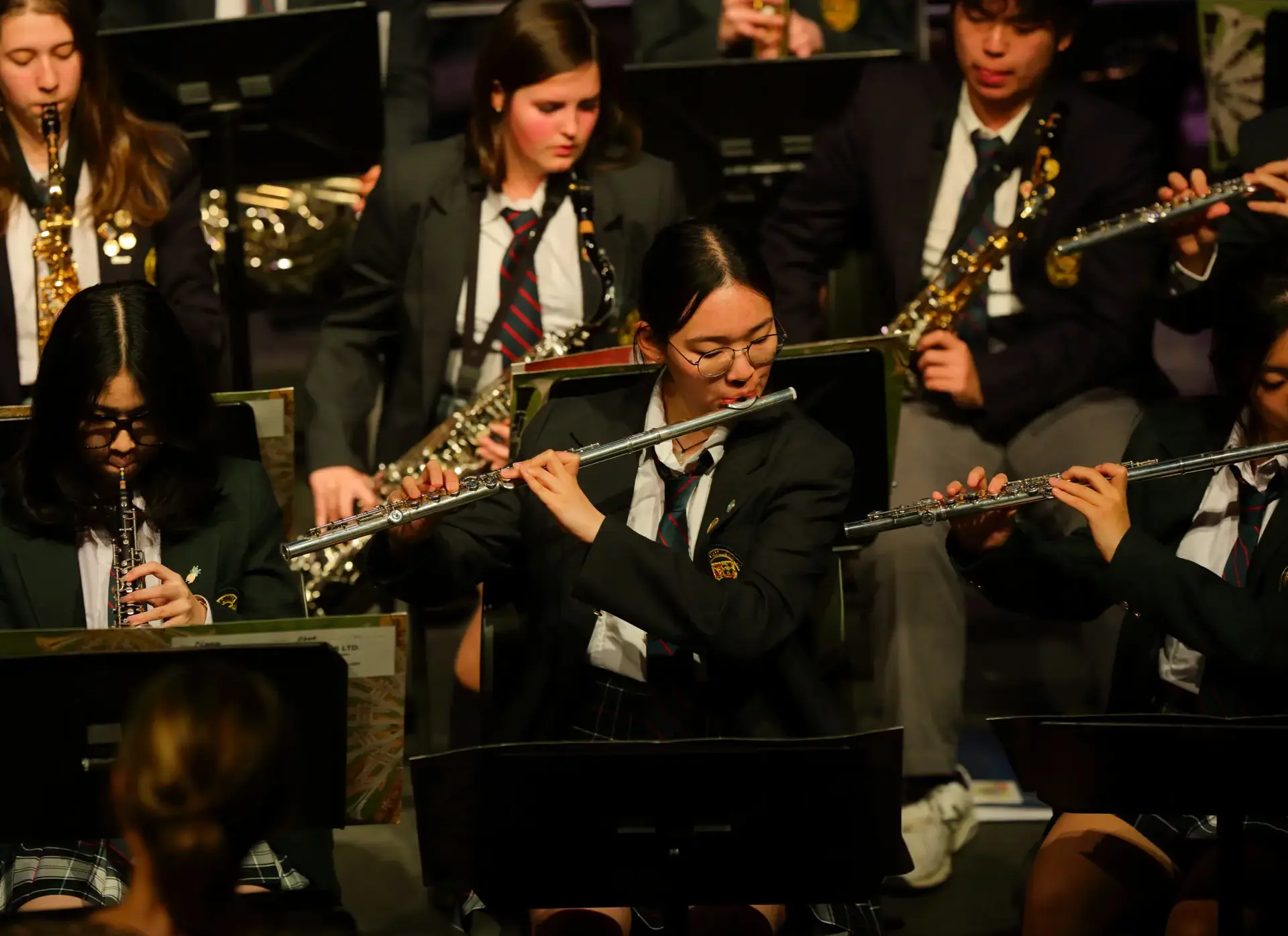Students playing woodwind and brass instruments