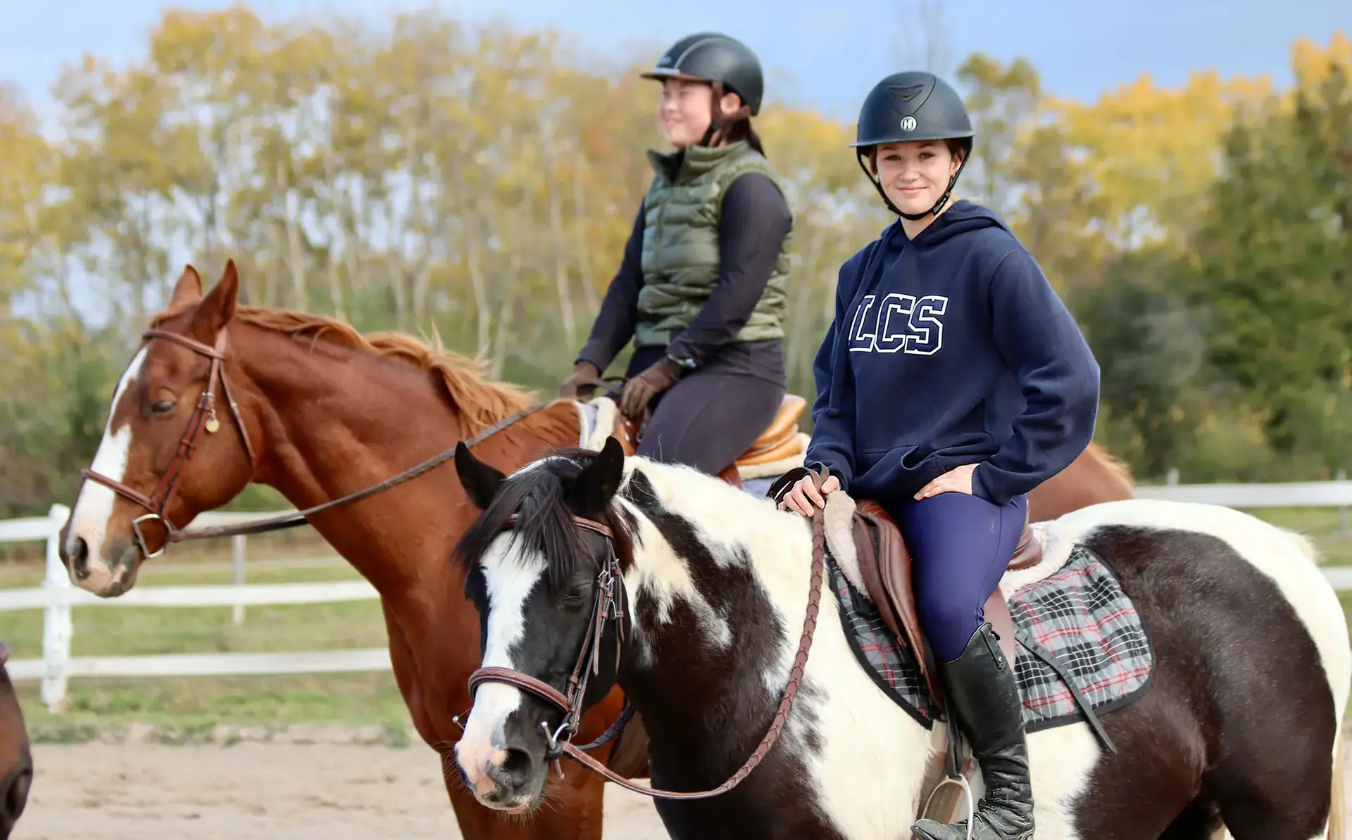 Students riding horses