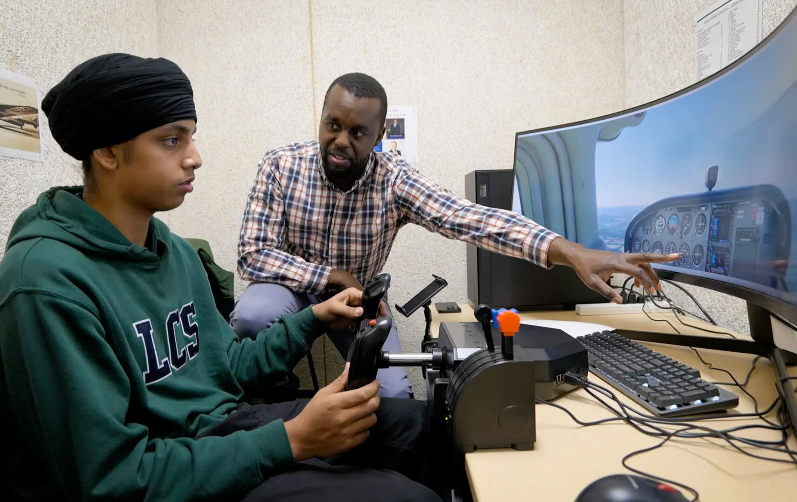 Student and teacher playing Flight Simulator