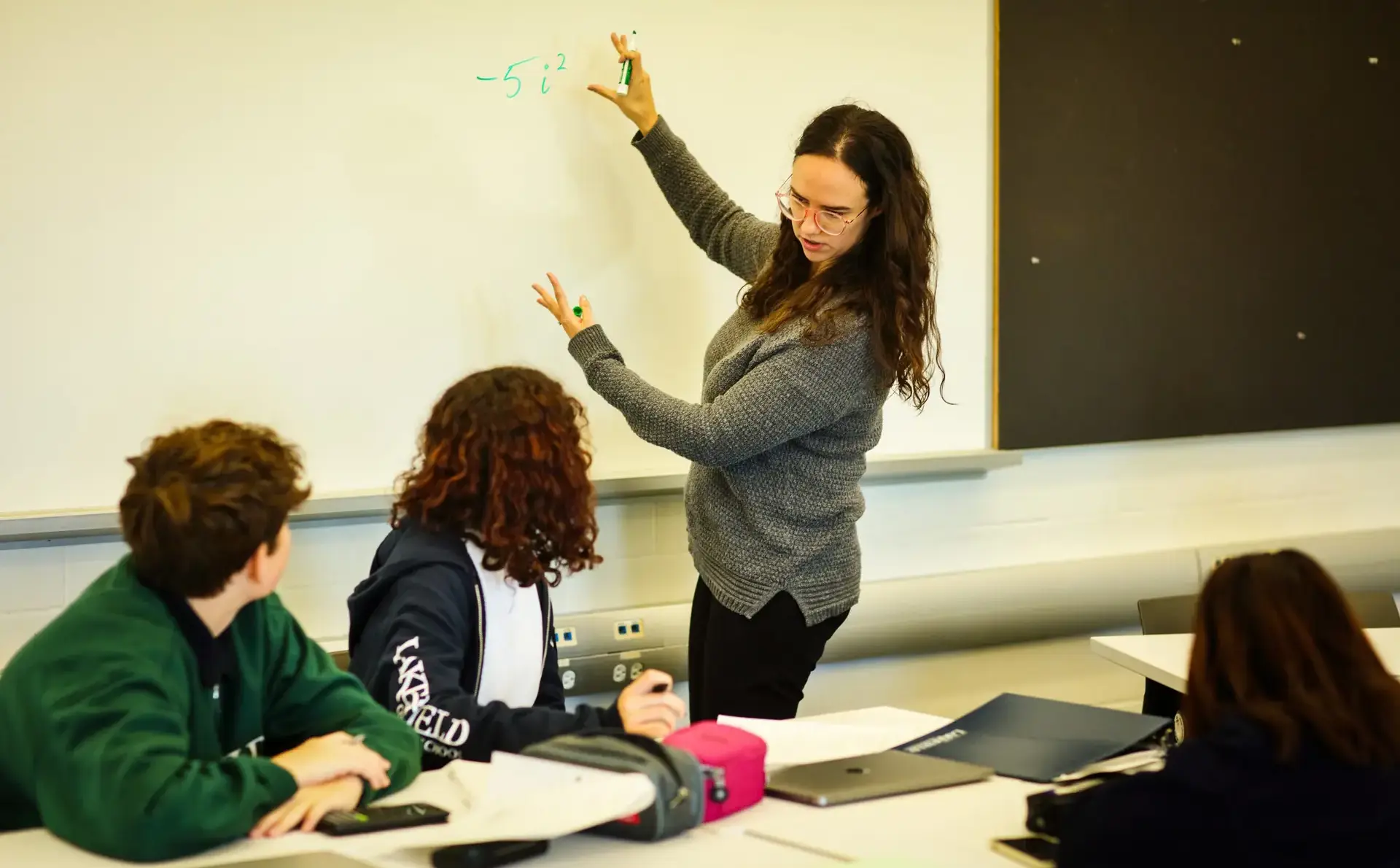 Teacher pointing at whiteboard