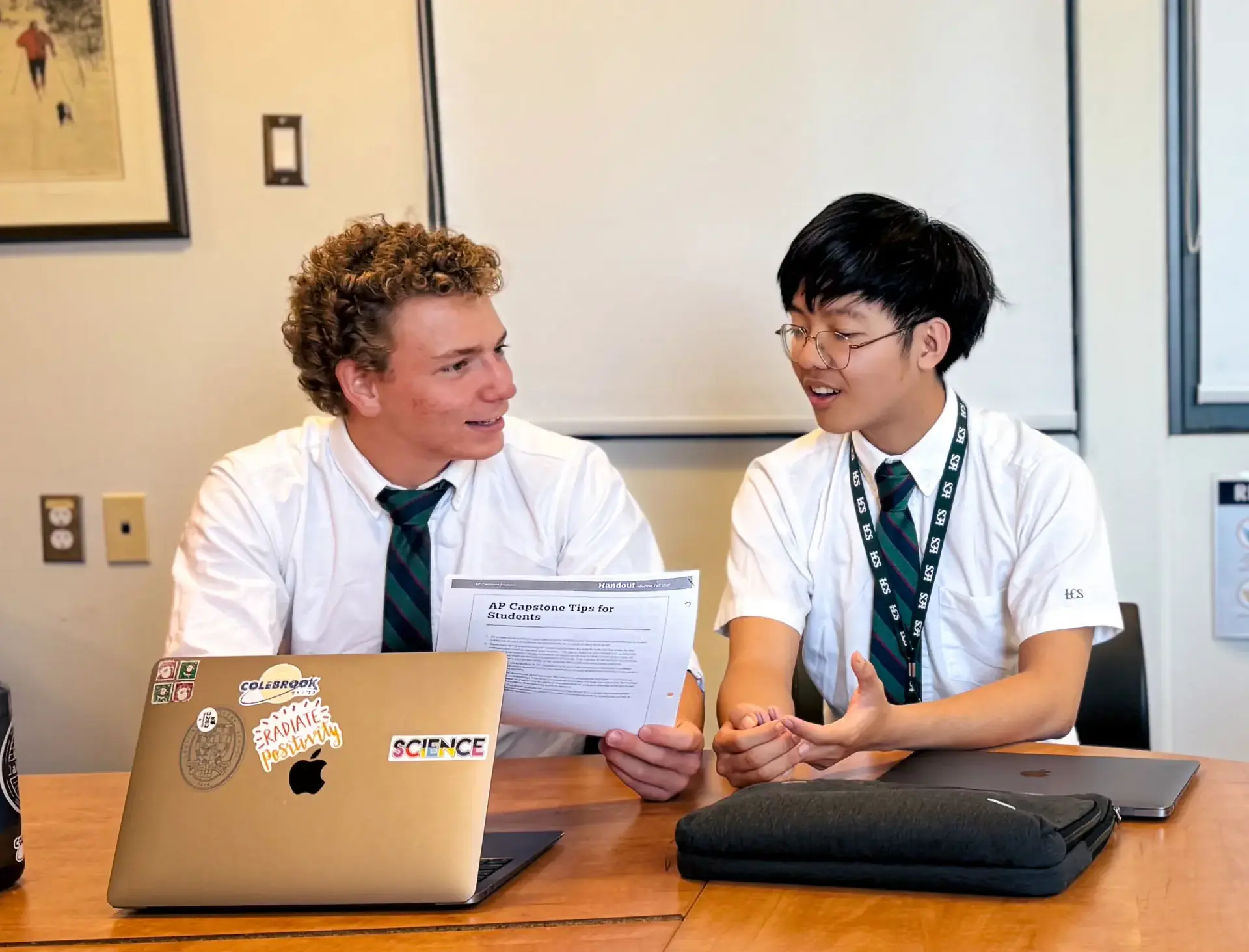 Two students discussing over their assignment