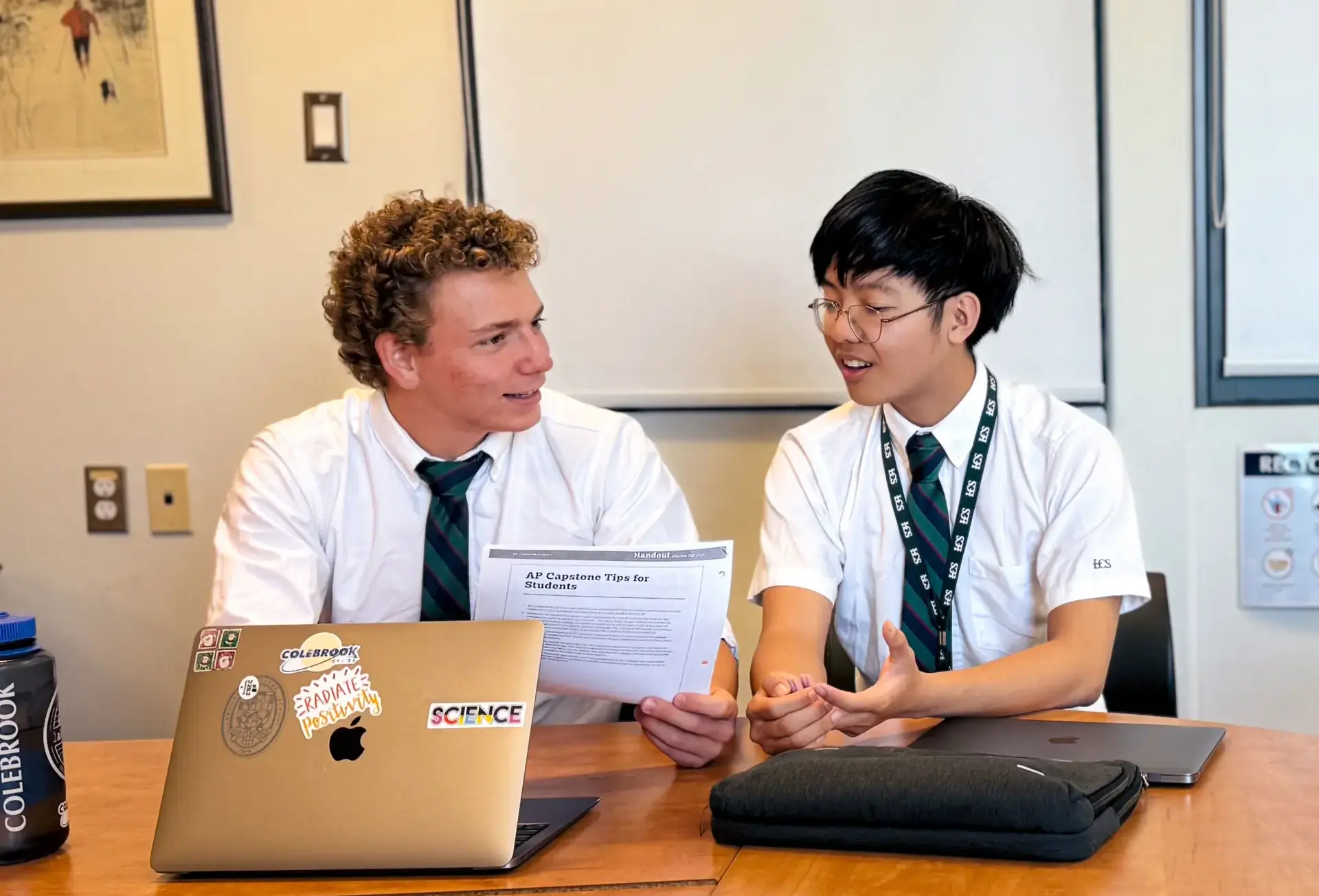 Students chatting at desk