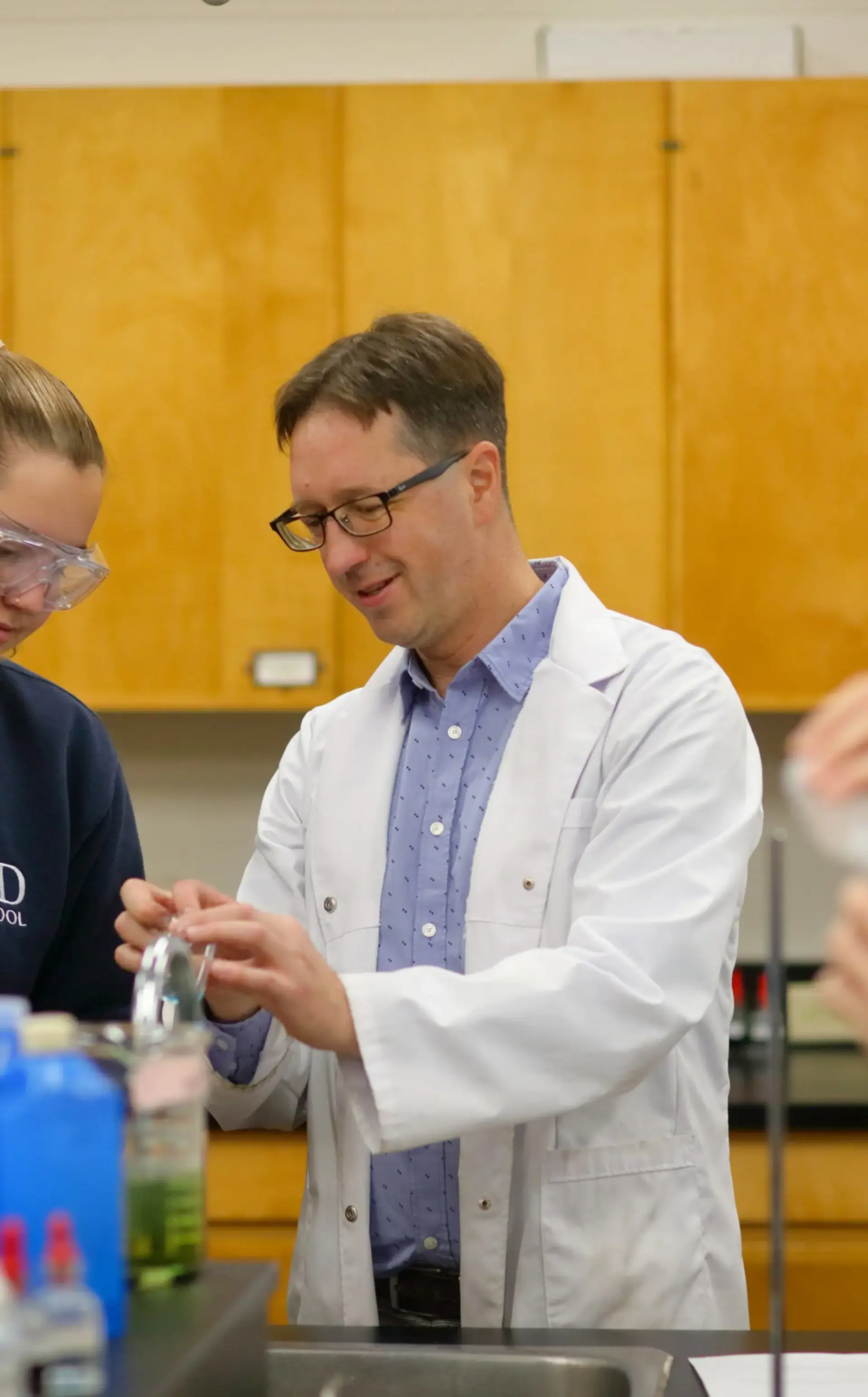 Teacher and student in lab