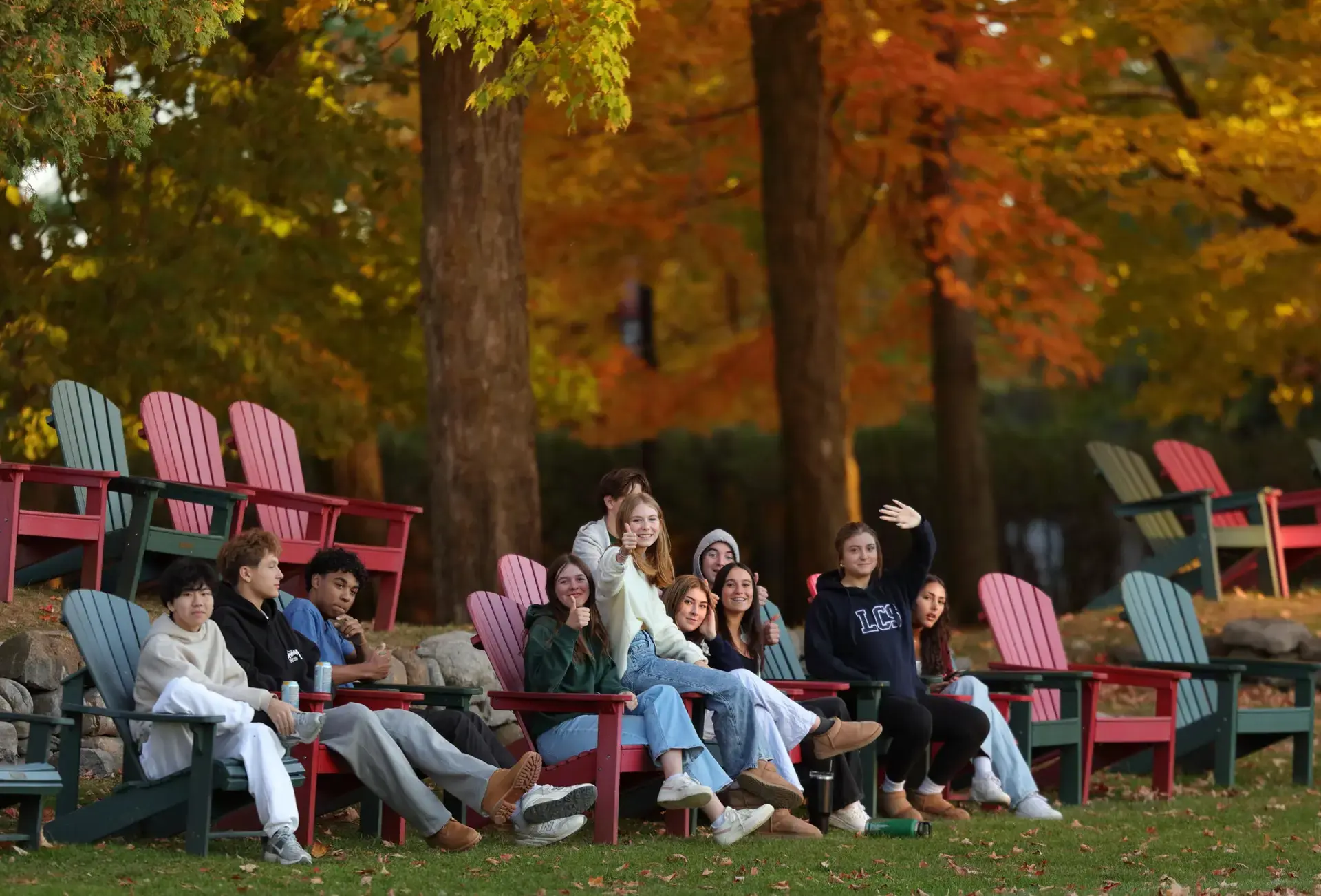Students sitting on outdoor furniture