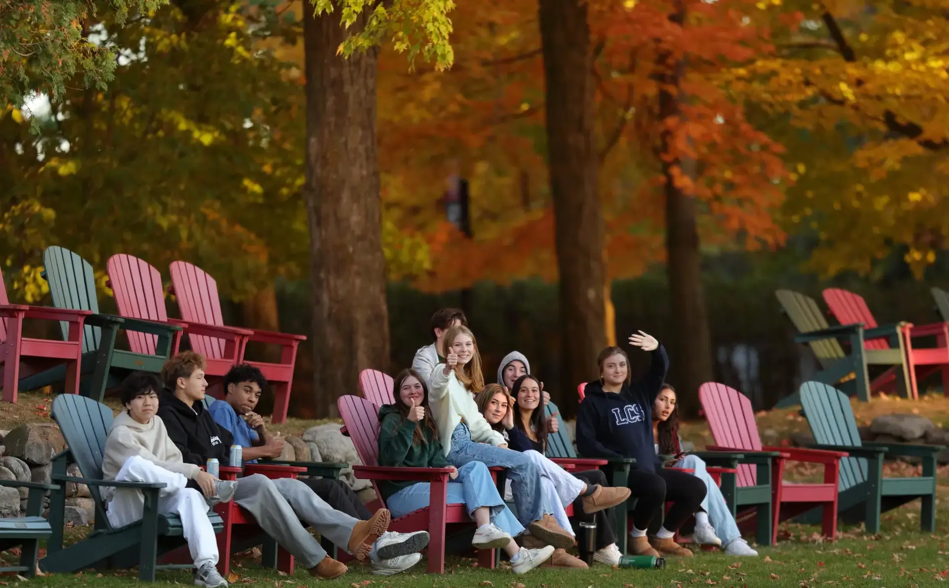 Students sitting on outdoor chairs 