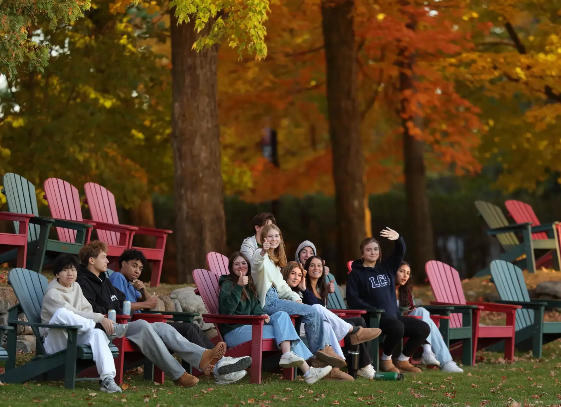Students sitting on outdoor furniture