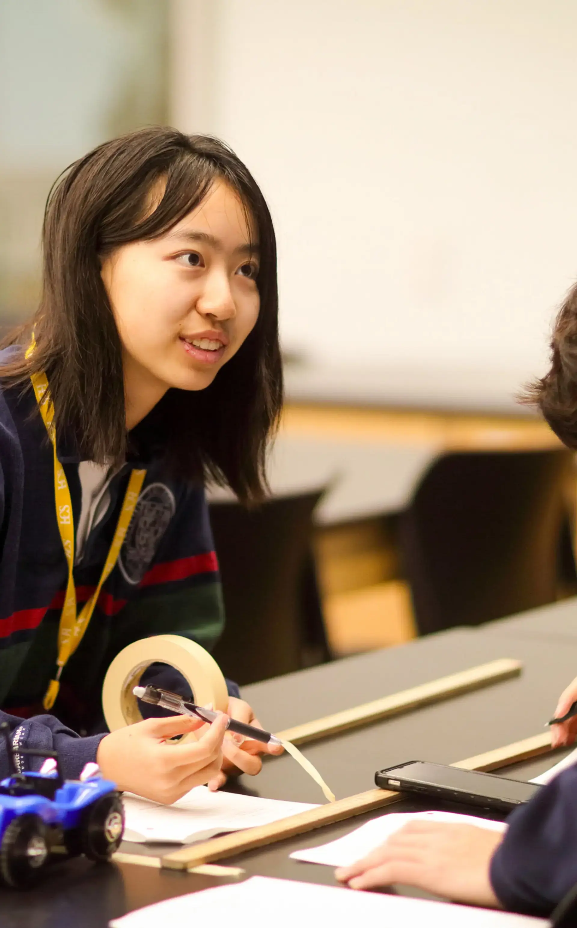 Student holding tape roll