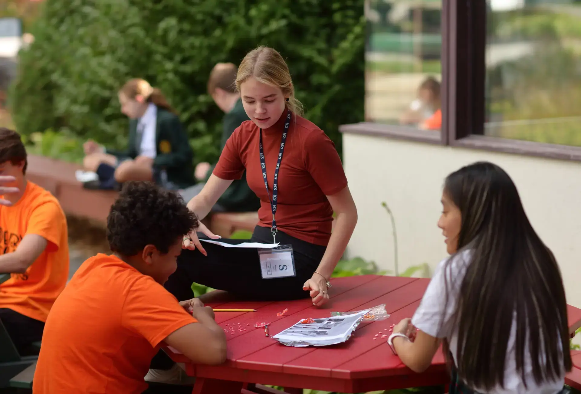 Students collaborating at outdoor table