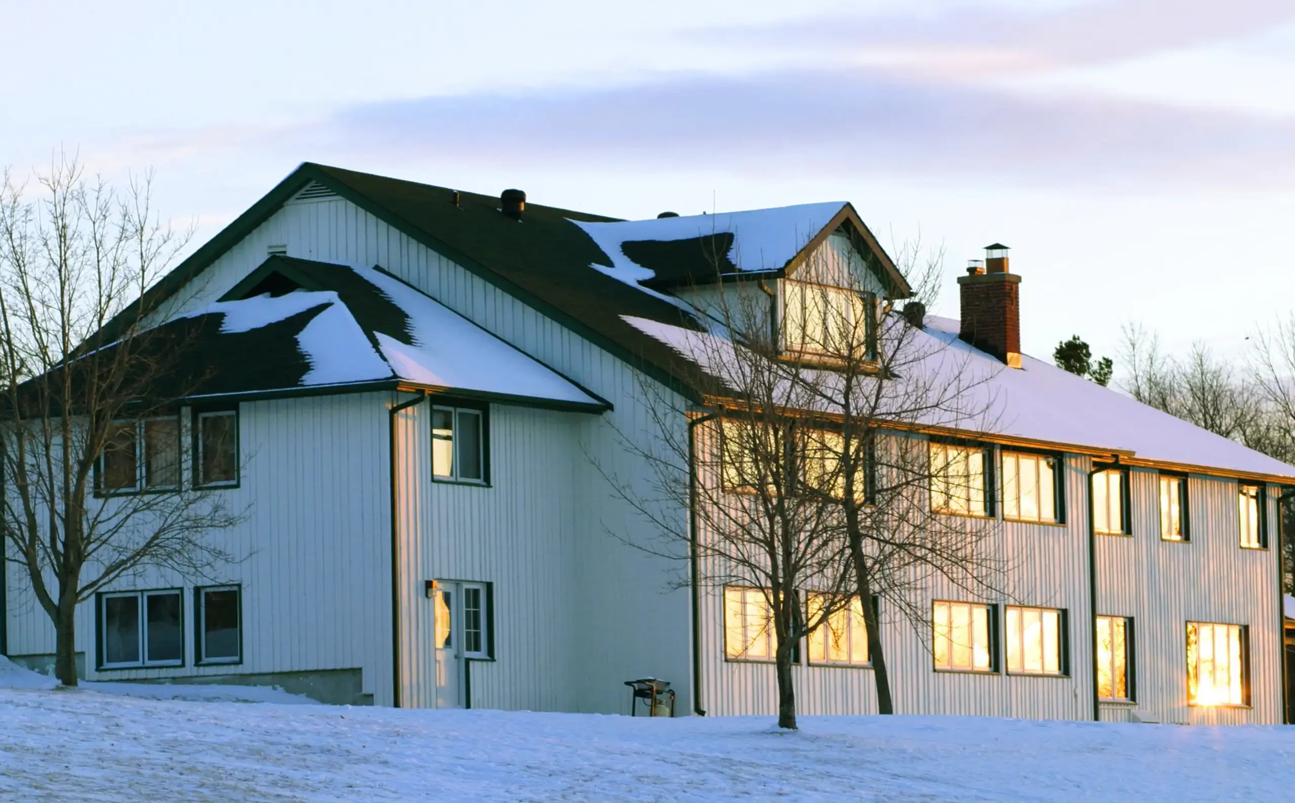 Exterior shot of Matthews House on a snowy evening