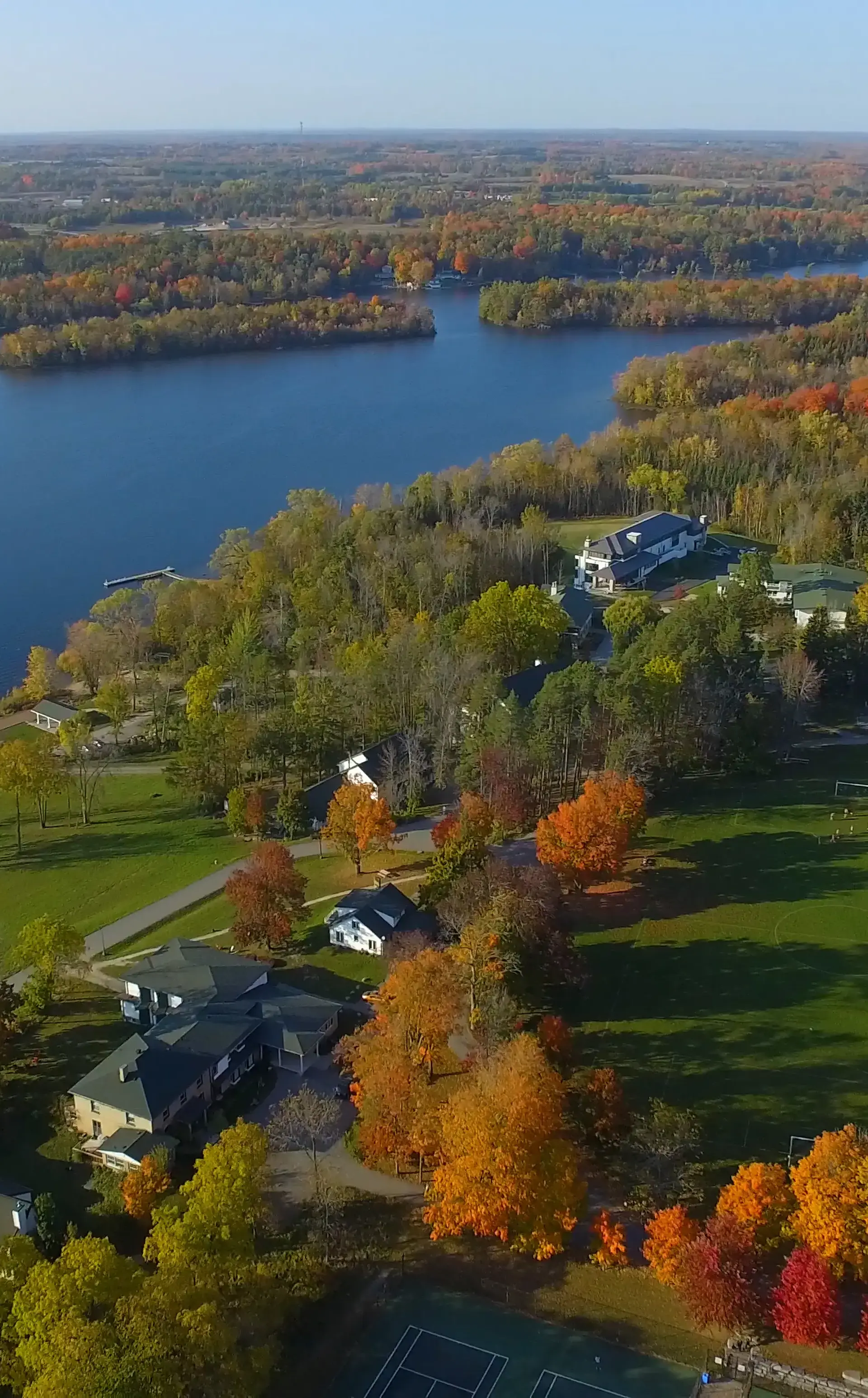 Aerial shot of Lakefield College School with the waterfront in the foreground 
