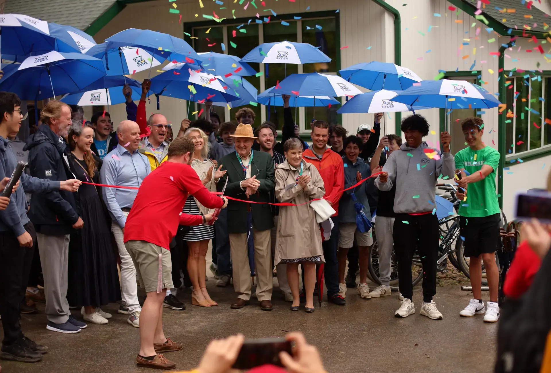 People holding umbrellas at opening ceremony