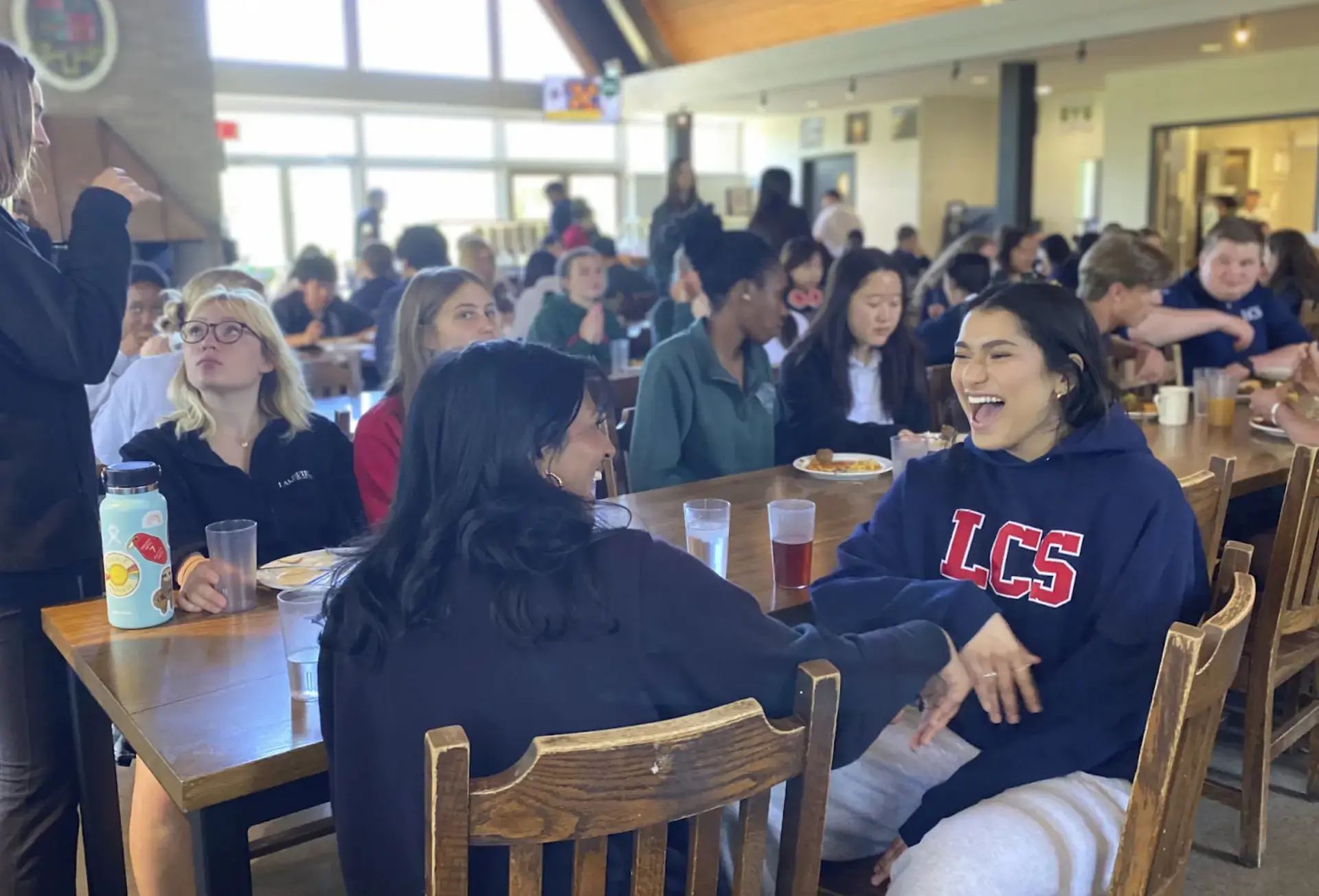 Students eating on long tables