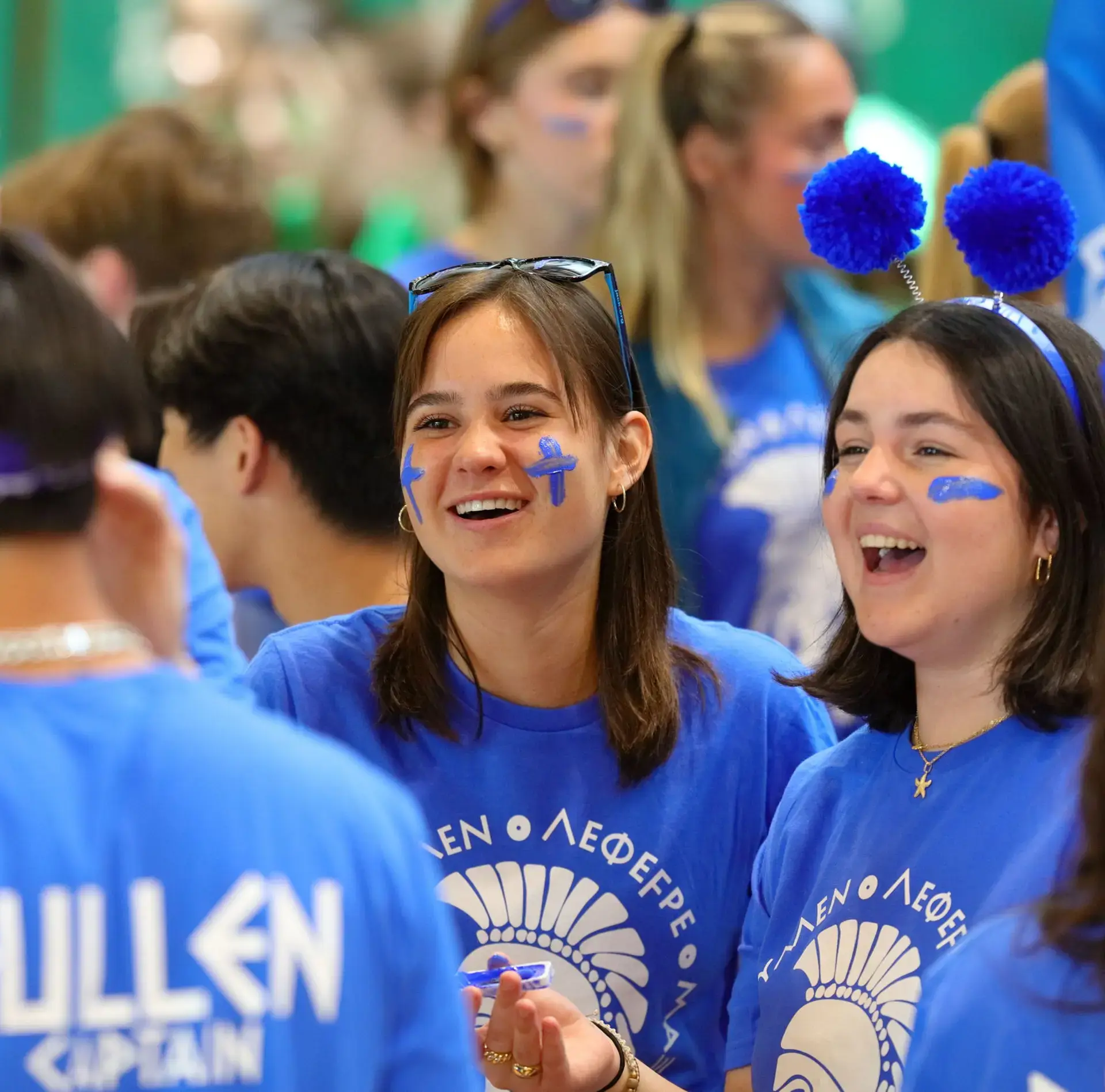 Students in House colours smiling