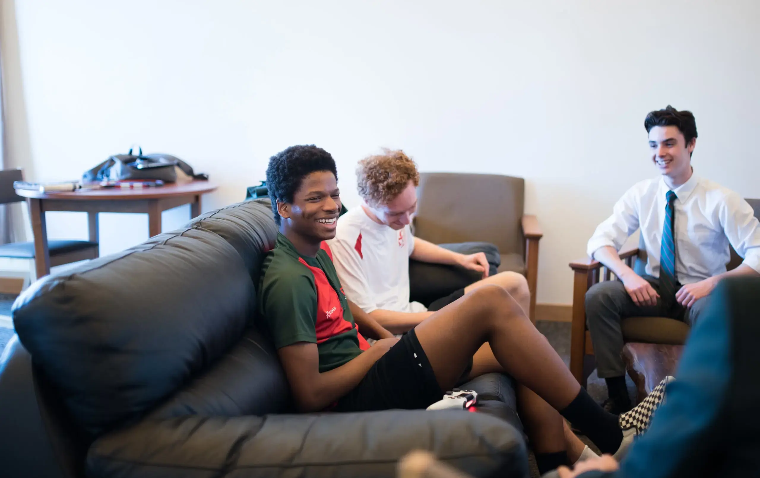 Three students relaxing in common area