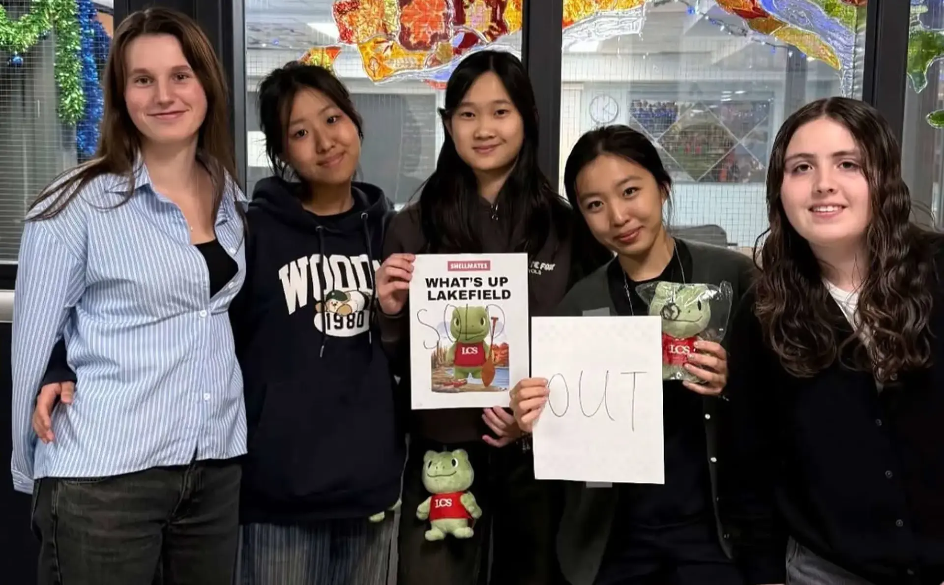 Students holding up 'sold out' signs