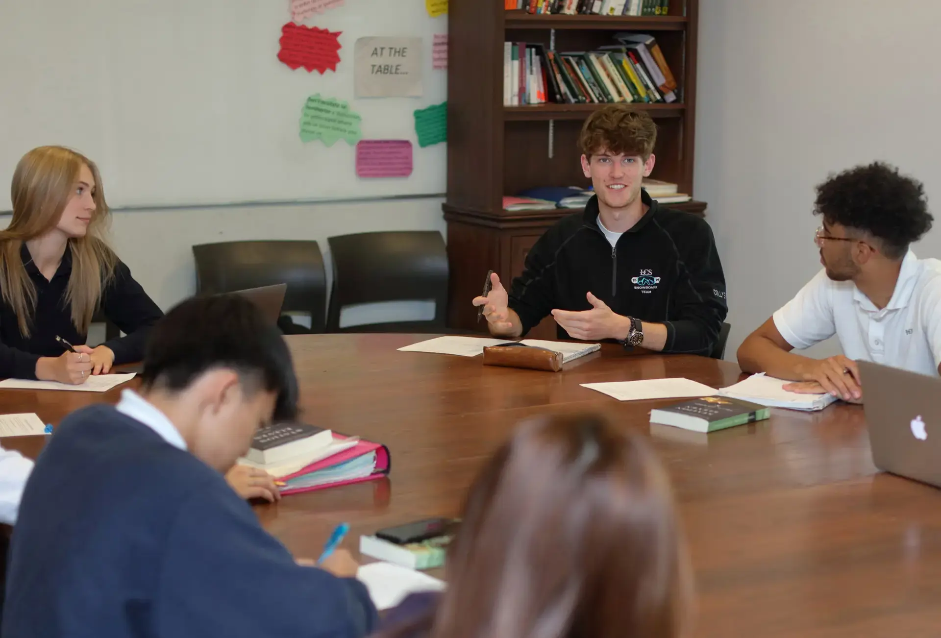 Students having a discussion around table