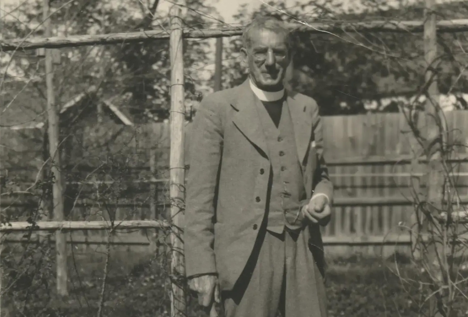 Archival photograph of Dr. Mackenzie standing in a garden