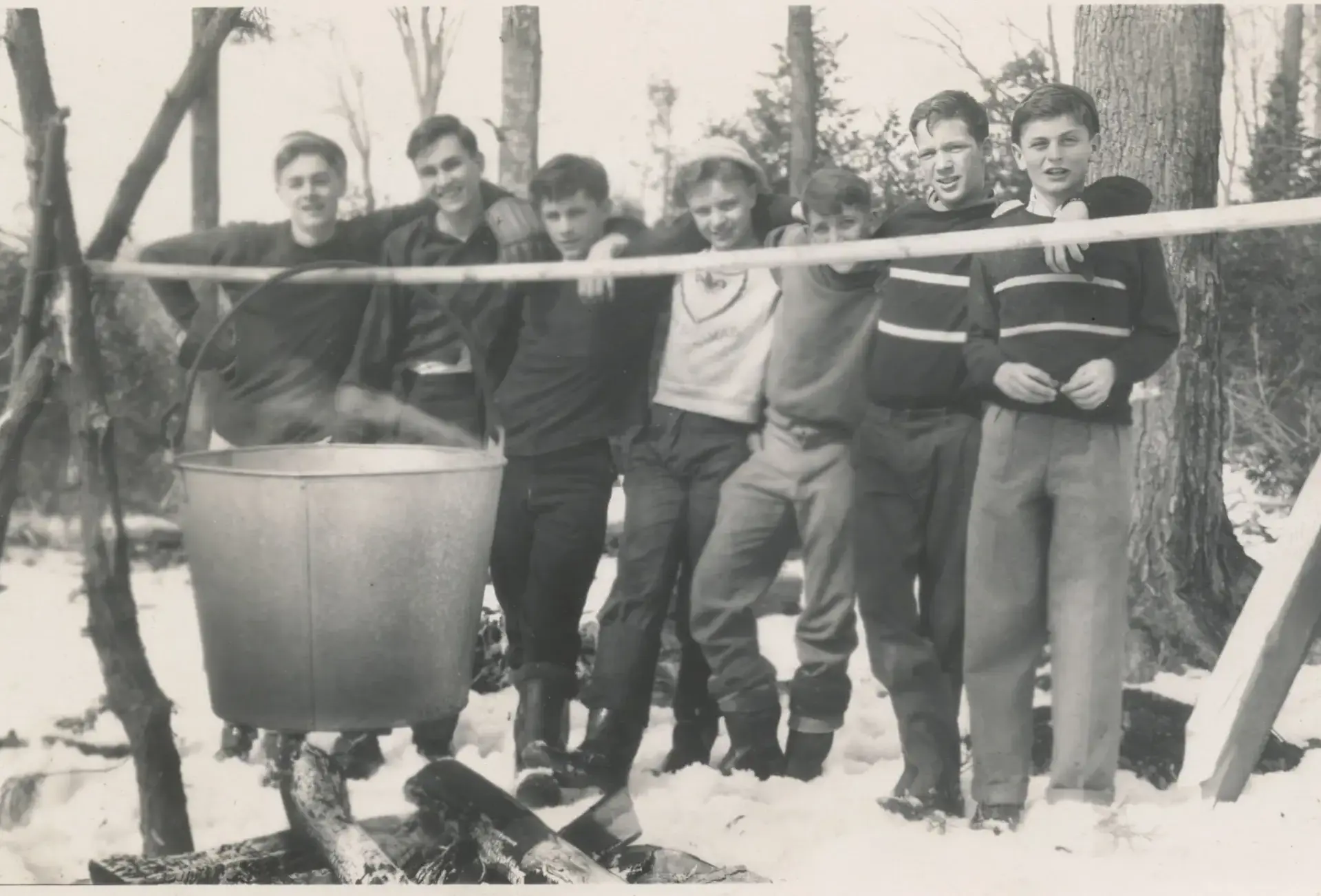 Archival photograph of students boiling maple syrup