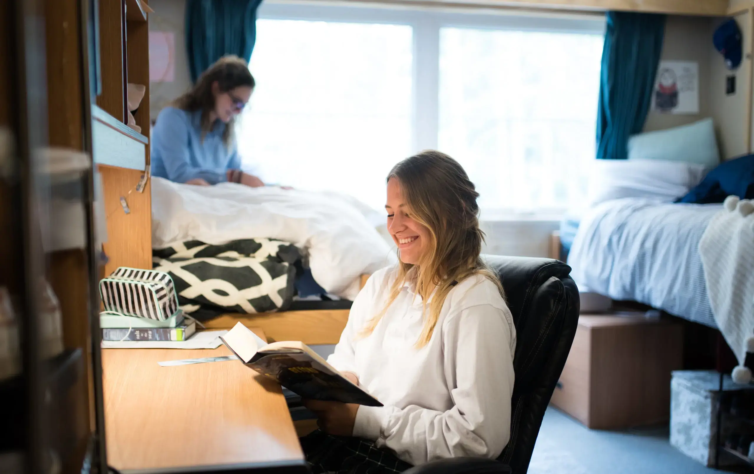 Student reading in dorm room