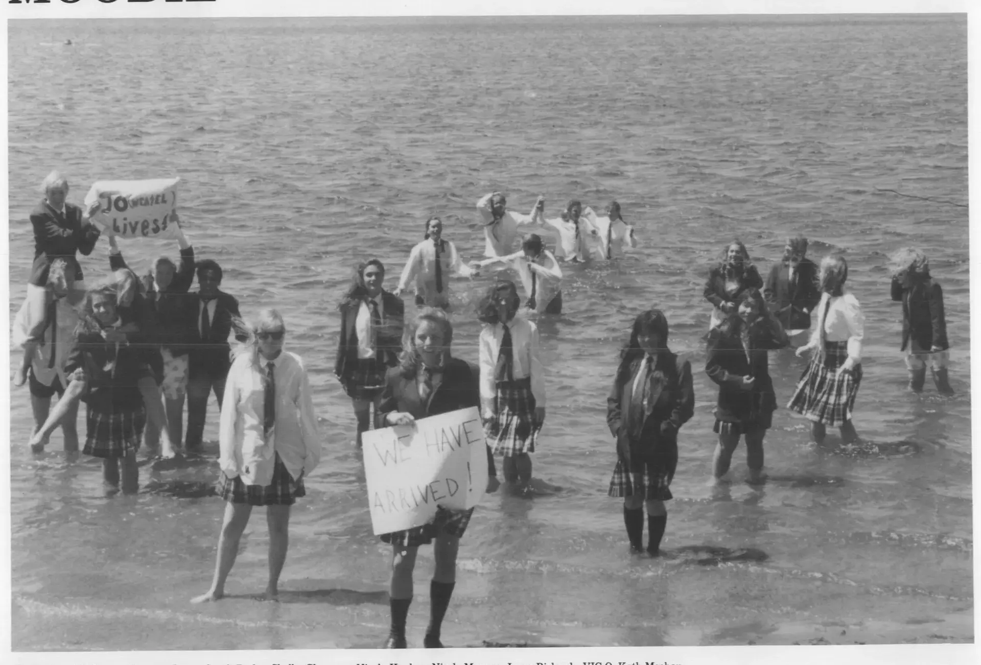 Newspaper clipping of female students standing in water