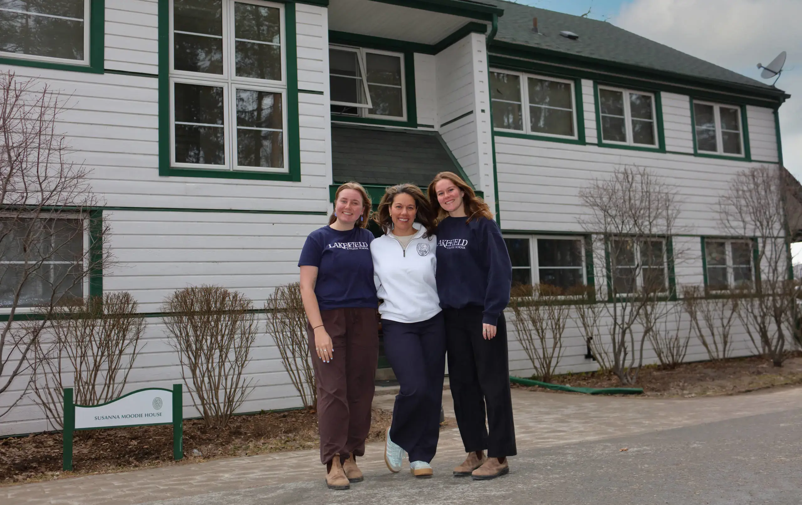 Moodie House team standing outside house building