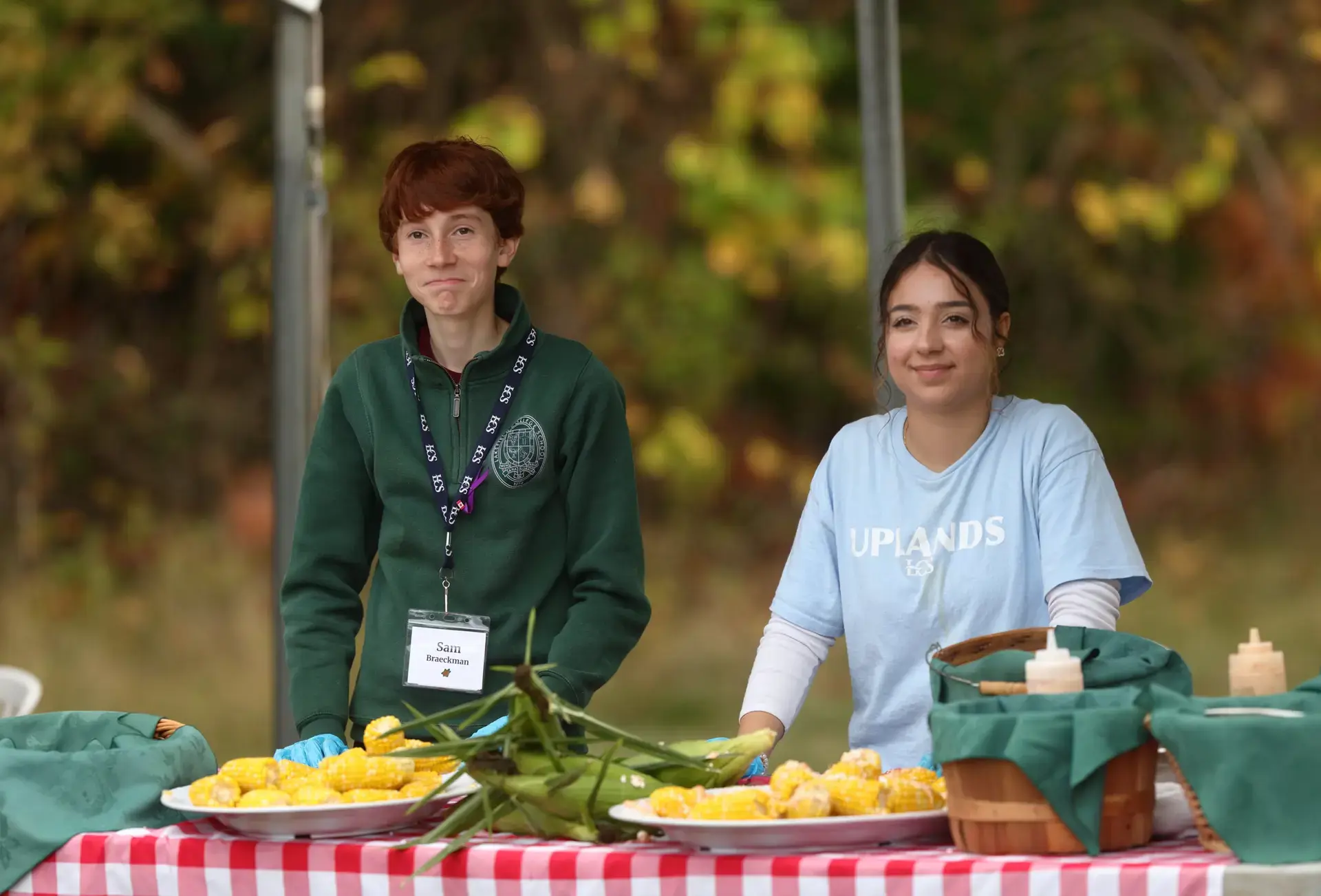 Students standing by table of produce