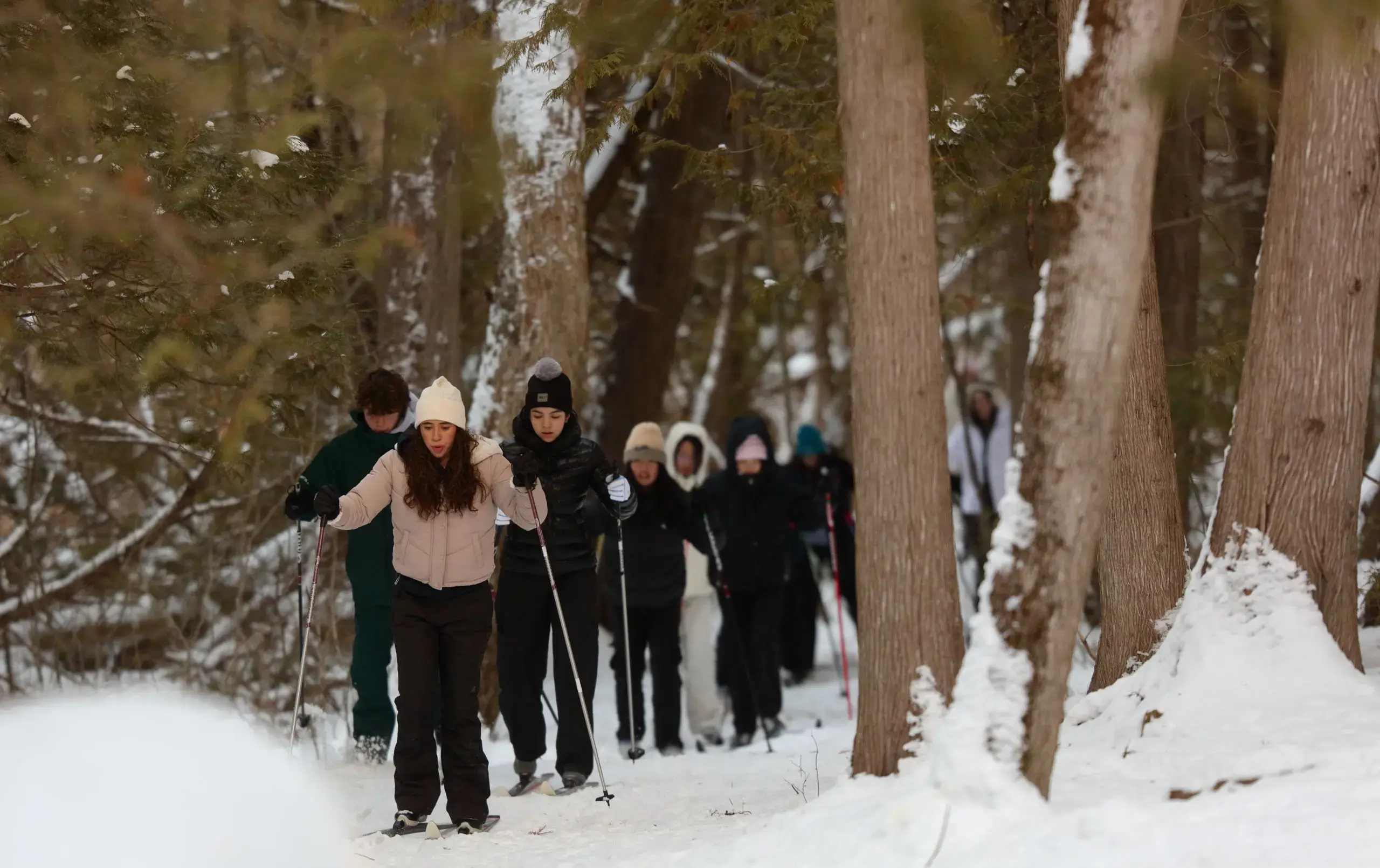 Students walking snowy trail