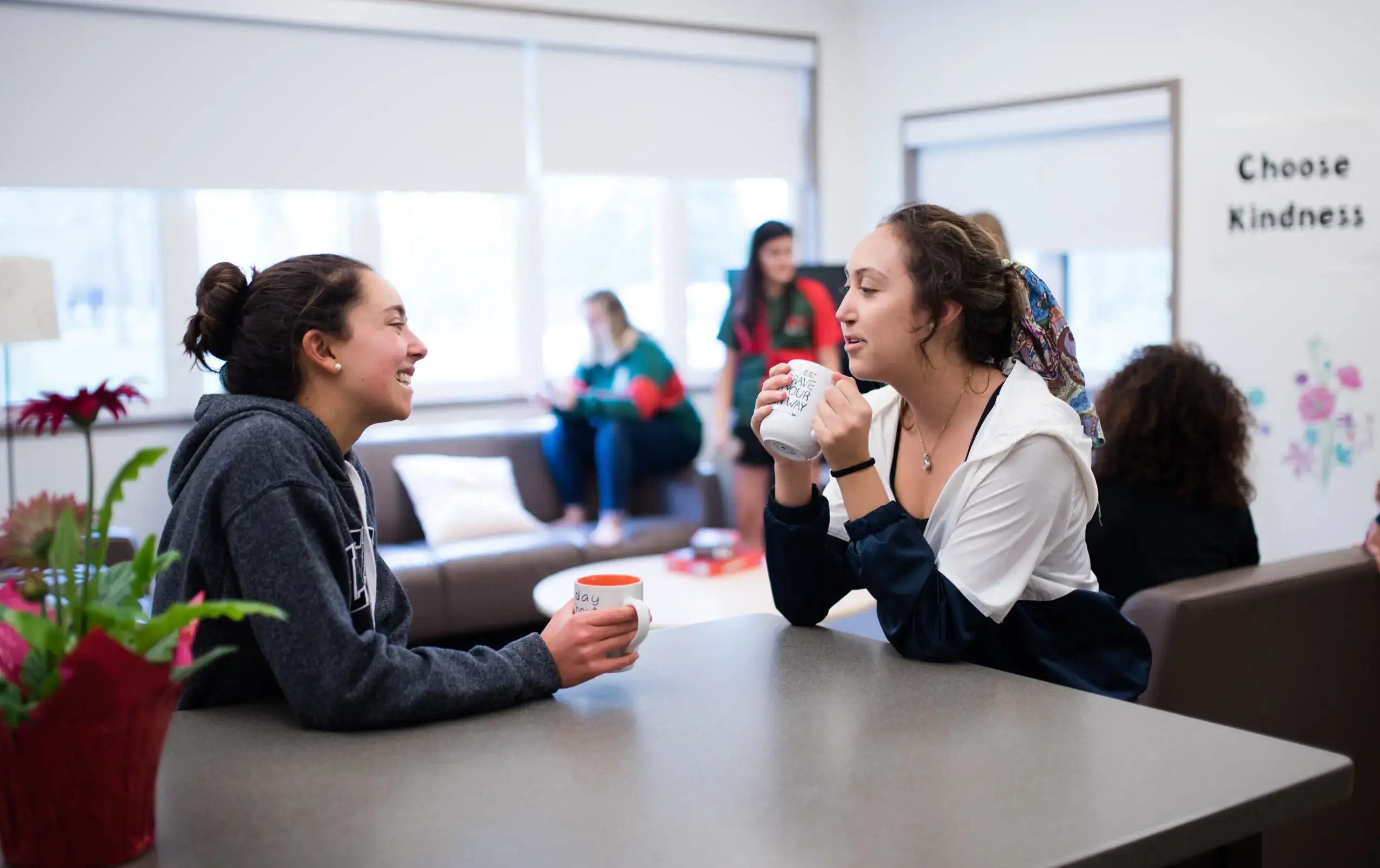 Students chatting over hot drinks