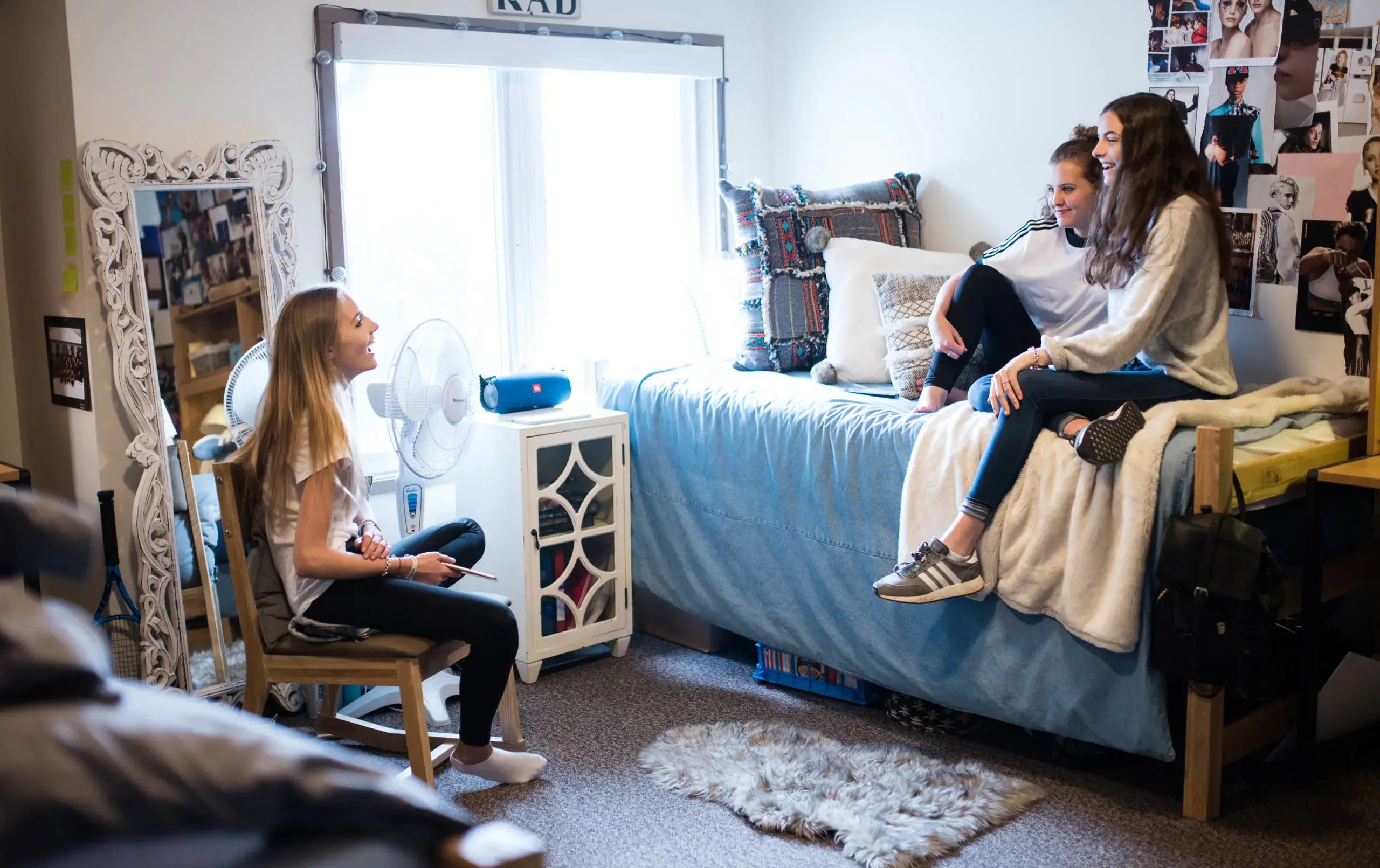 Three students in dorm room