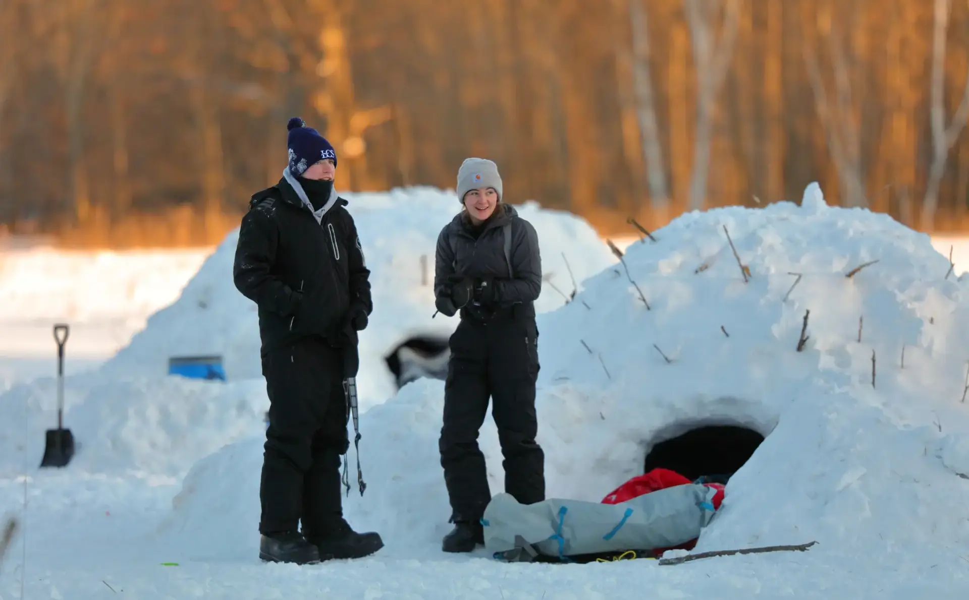 Students standing outside quinzee
