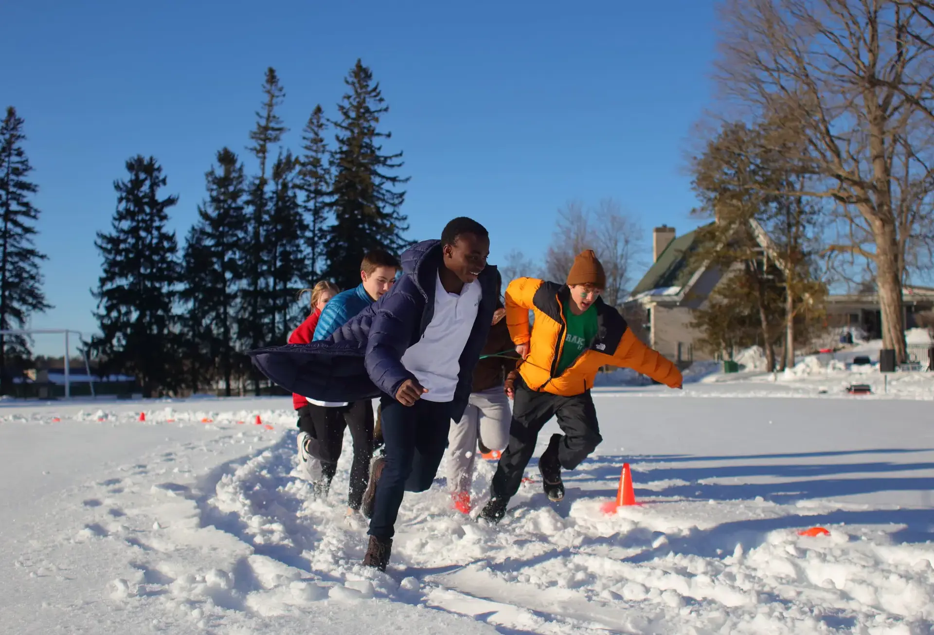 Students running snow race