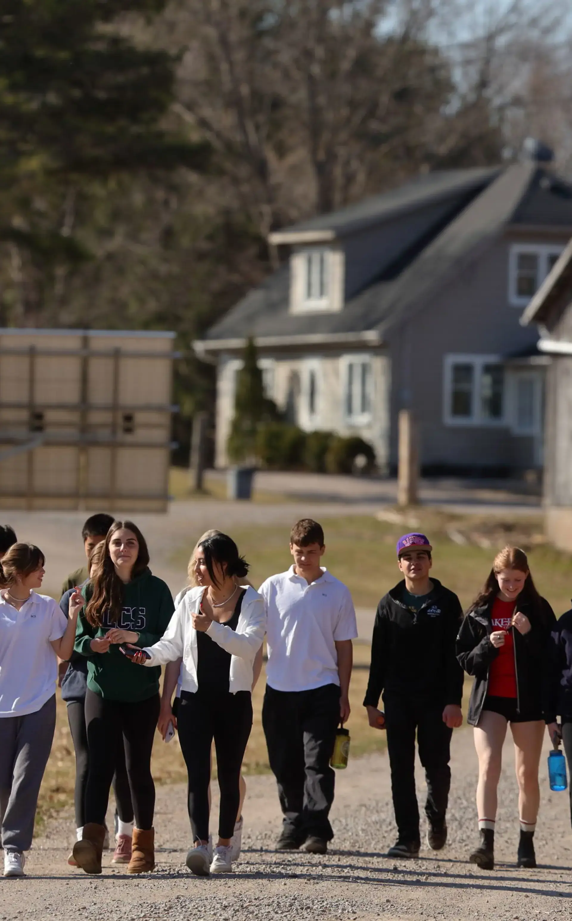 Students walking down gravel path on Northcote Farm