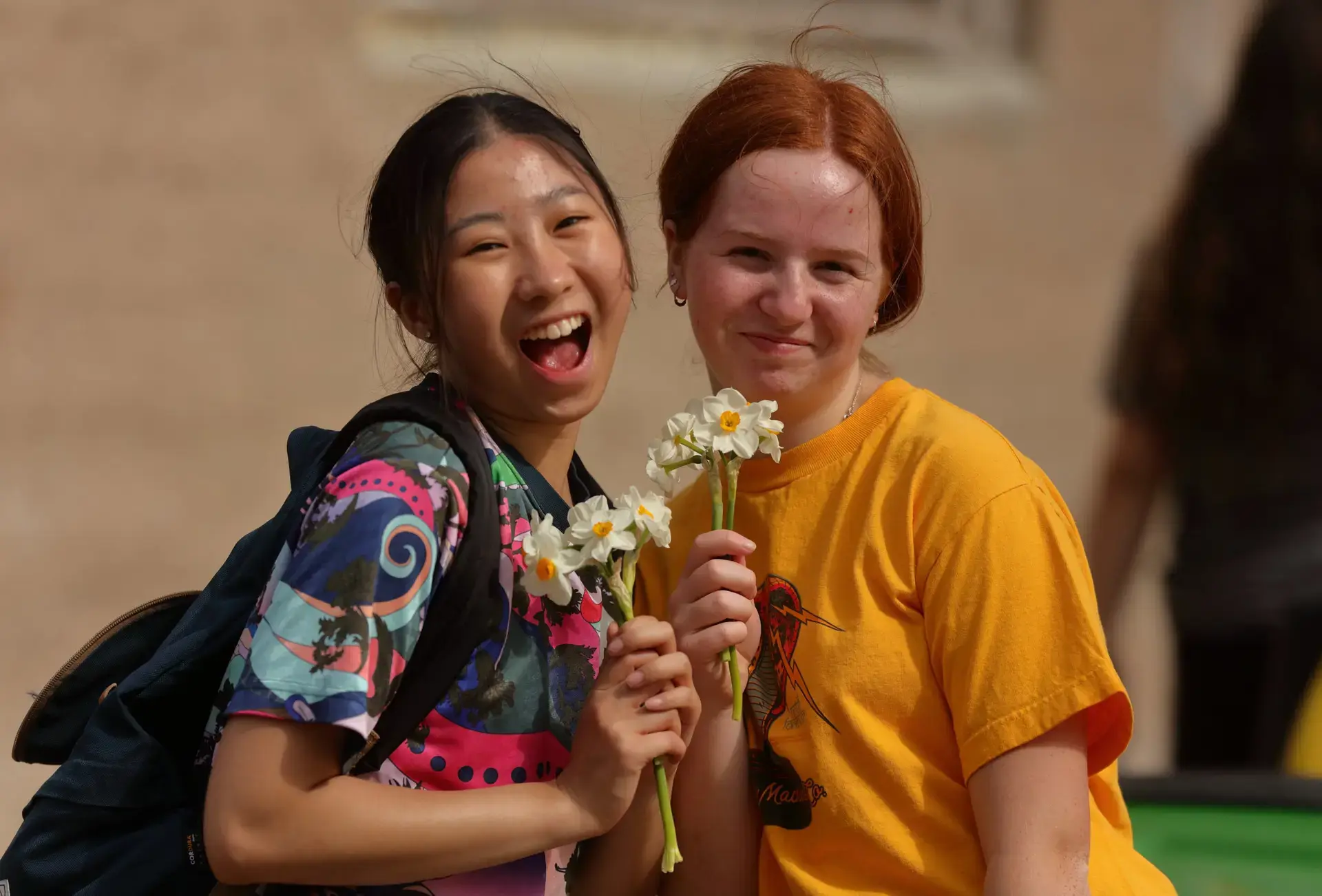 Students holding flowers
