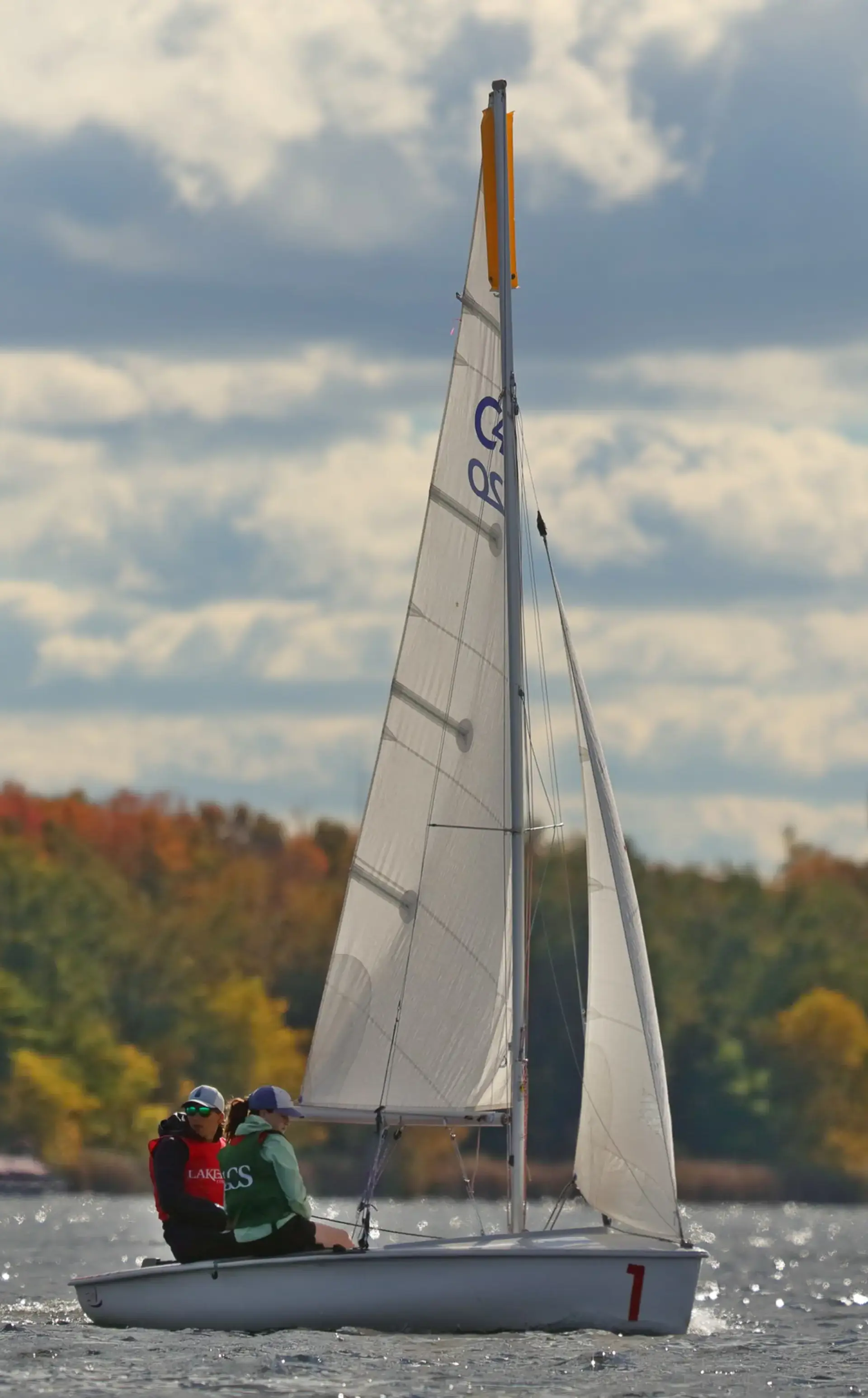 Student sailing on lake