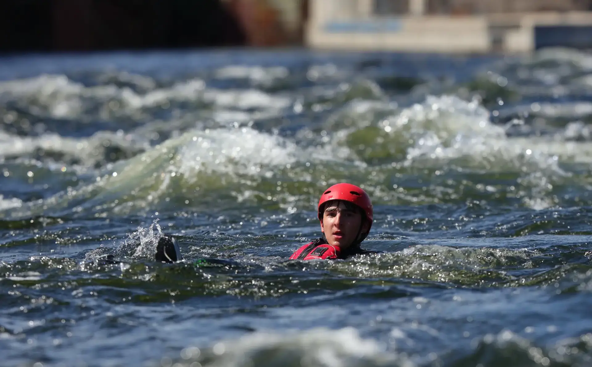 Student's head poking out of water