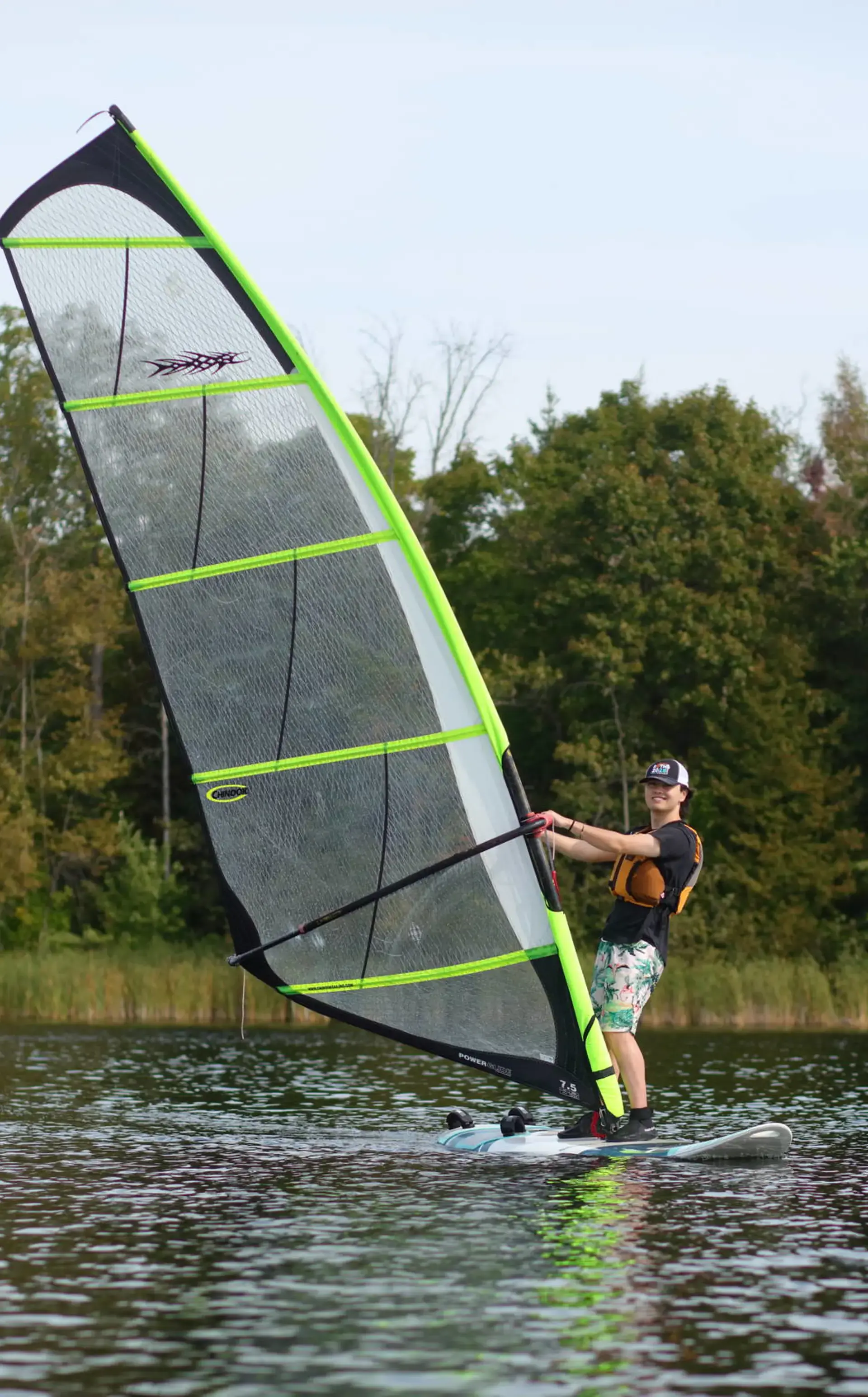Student sailing on lake