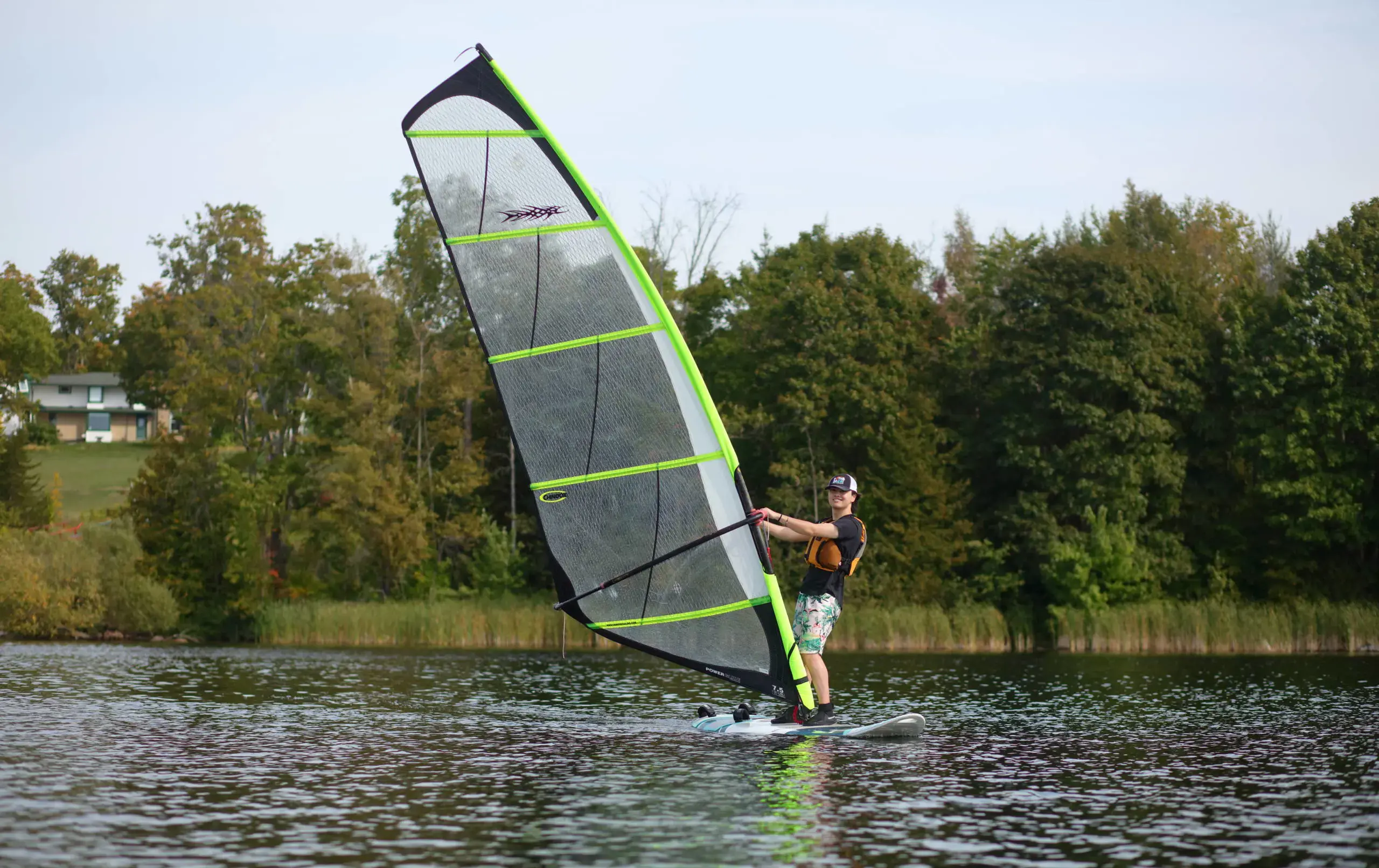 Student sailing on lake