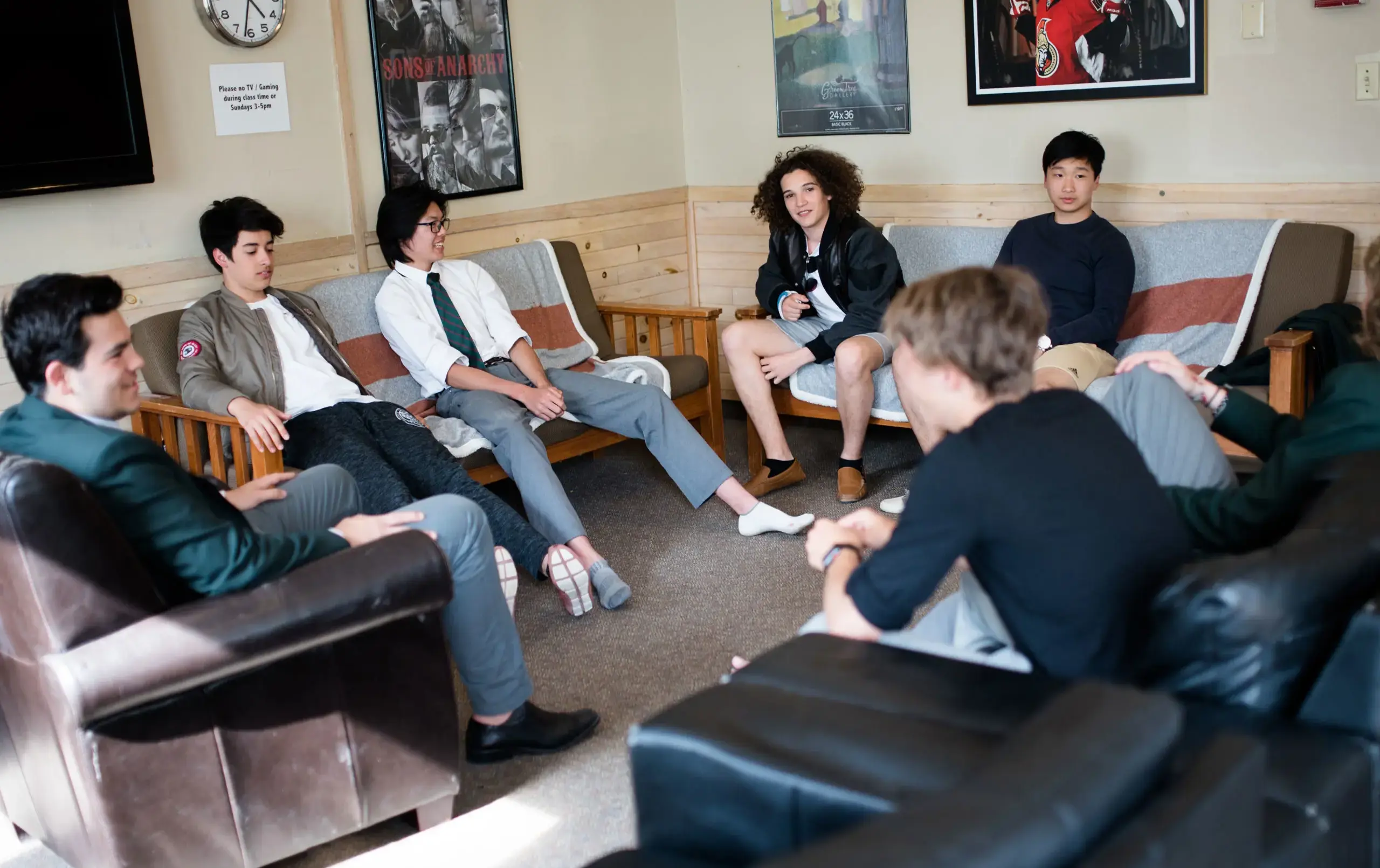 Students sitting on sofas in common area