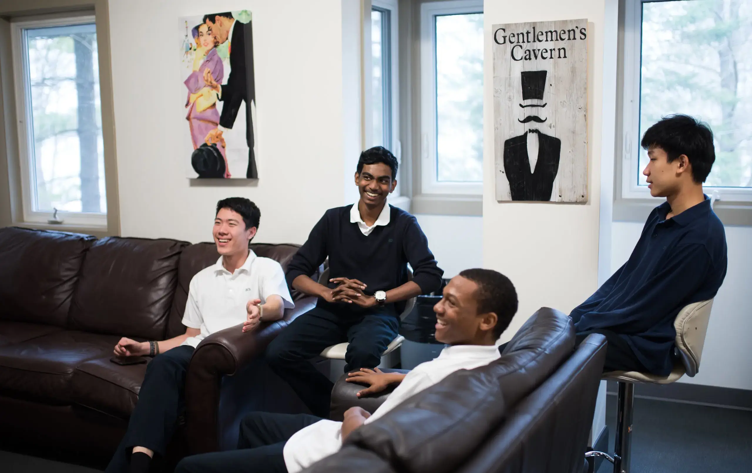 Four students hanging out in common area
