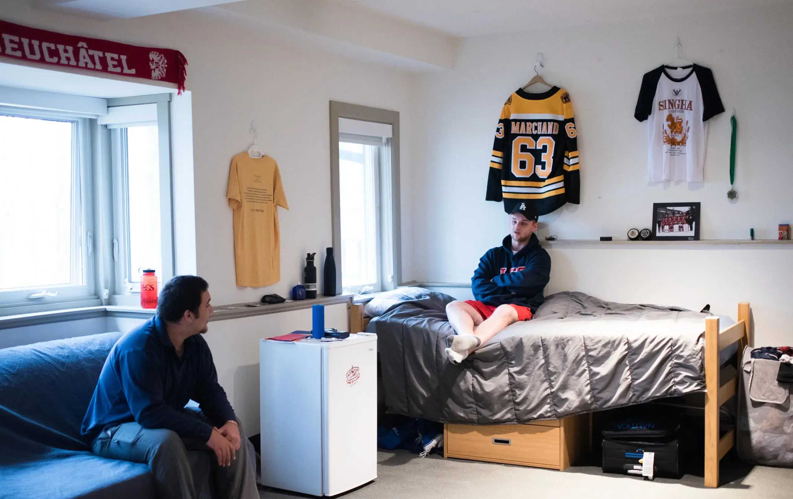 Two students hanging out in dorm room