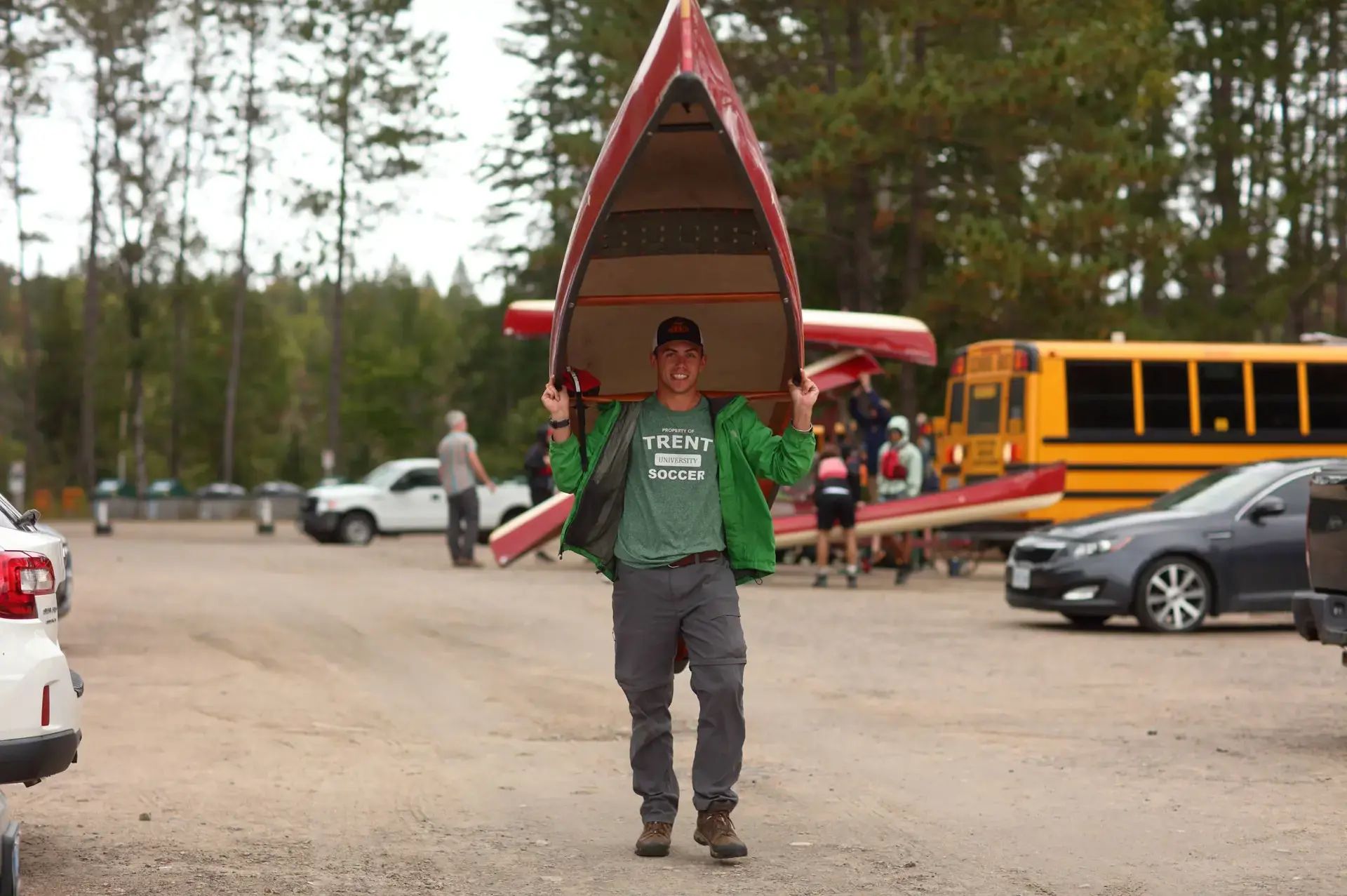 Peter Rowley carrying a canoe