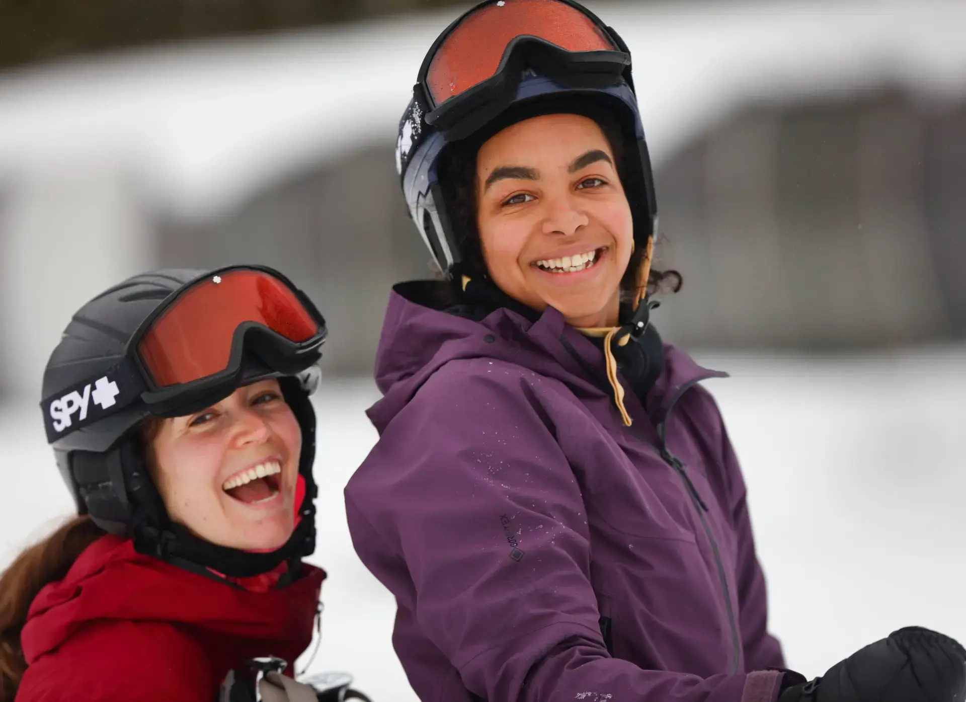 Two smiling students in winter gear