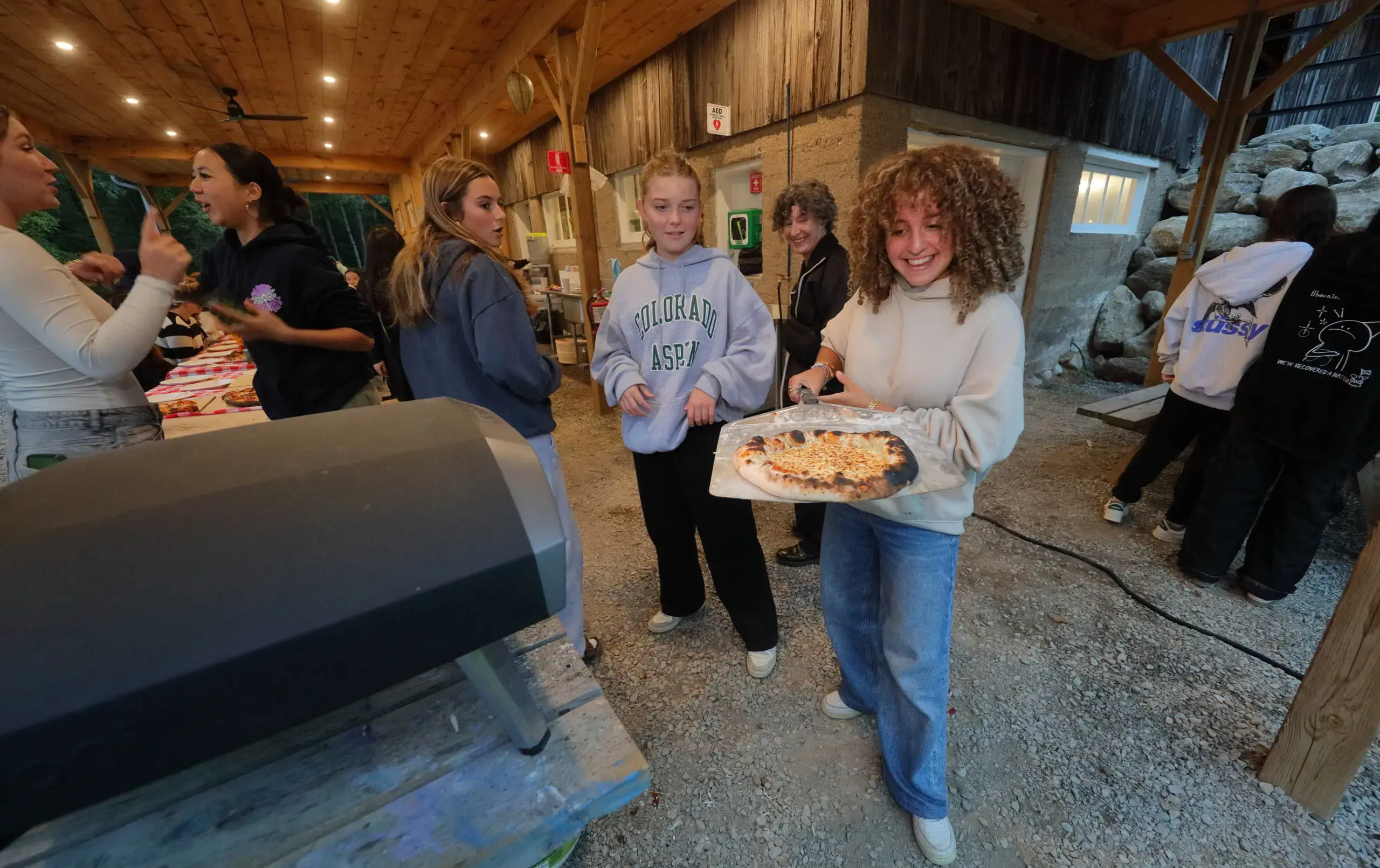 Students serving food at house dinner
